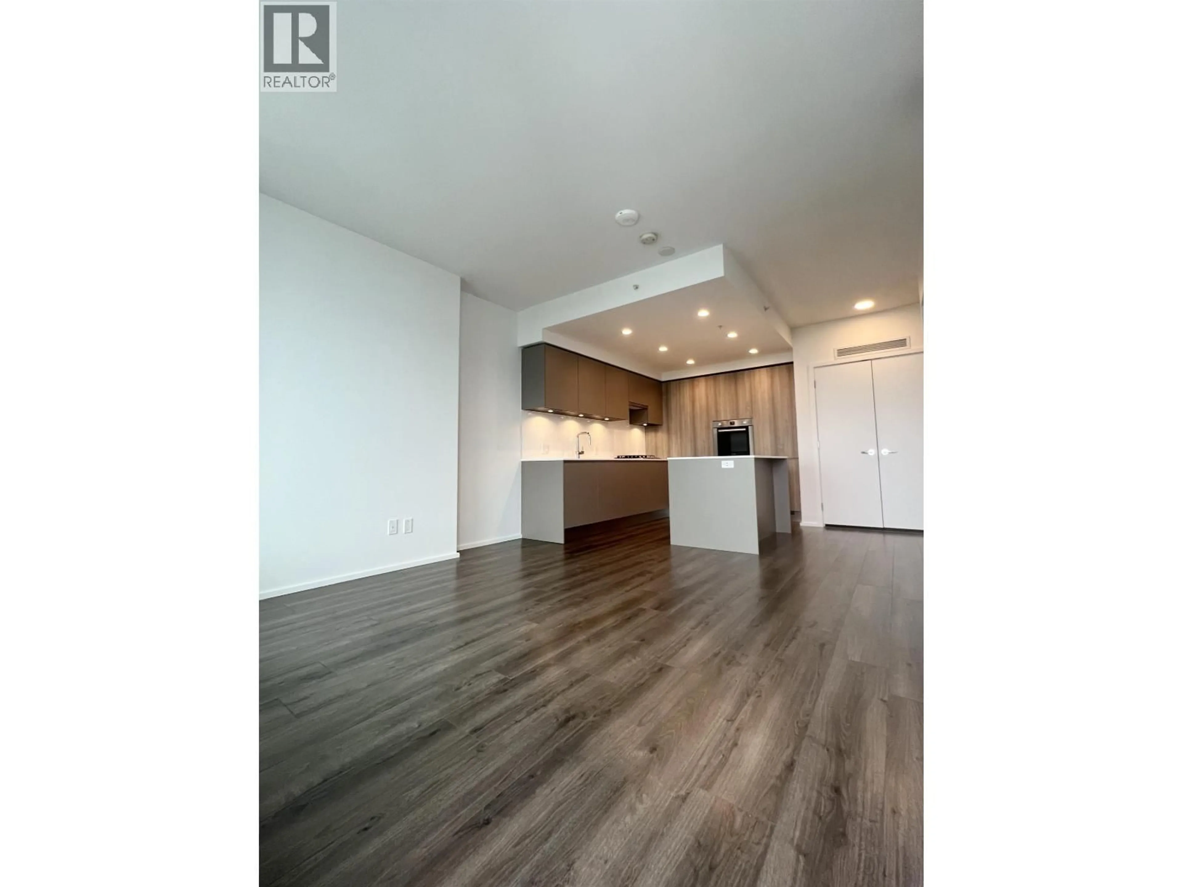 Open concept kitchen, wood/laminate floor for 4704 - 3809 EVERGREEN PLACE, Burnaby British Columbia V3J0M1