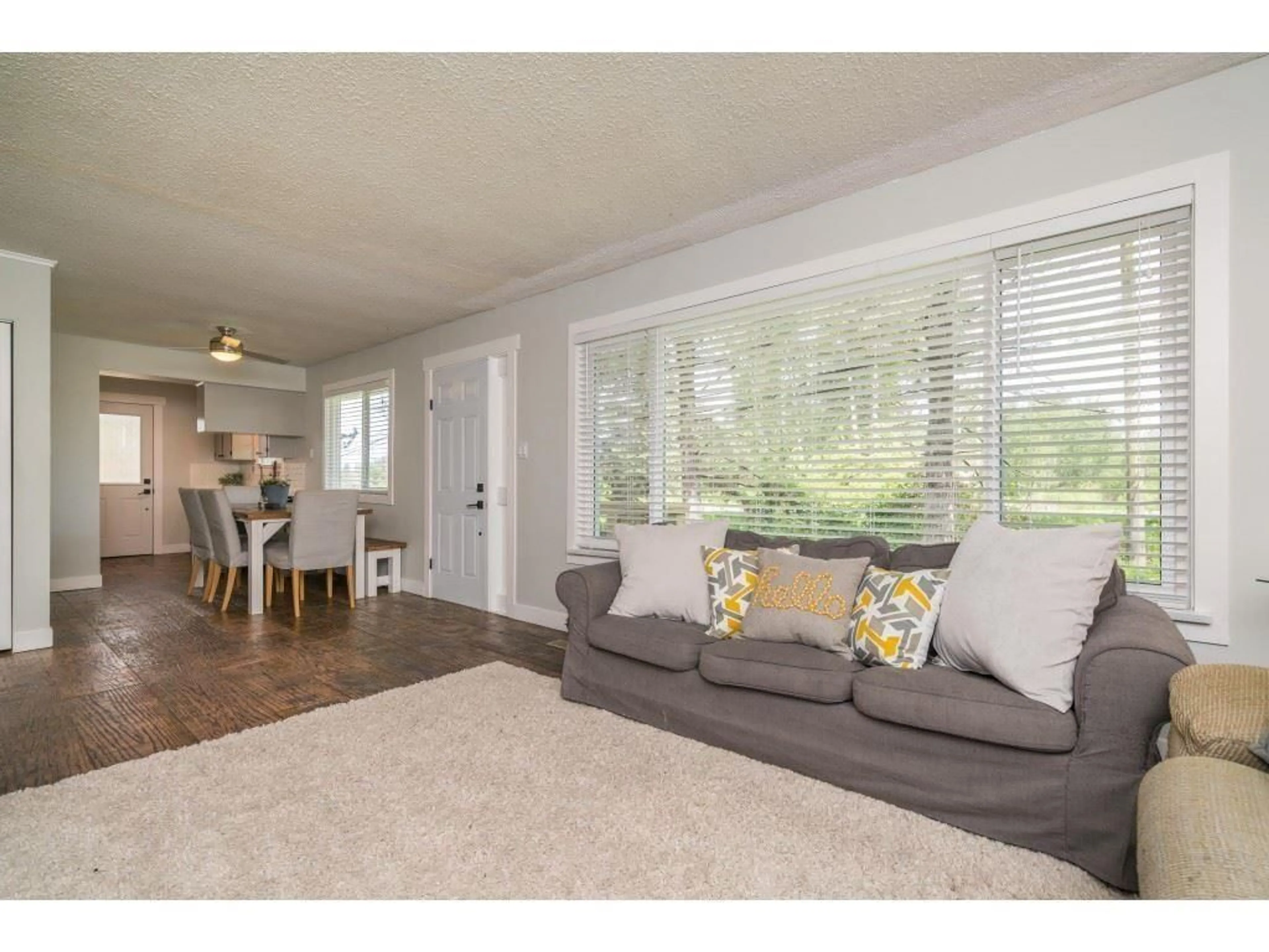 Living room with furniture, wood/laminate floor for 23768 FRASER HIGHWAY, Langley British Columbia V2Z2K8