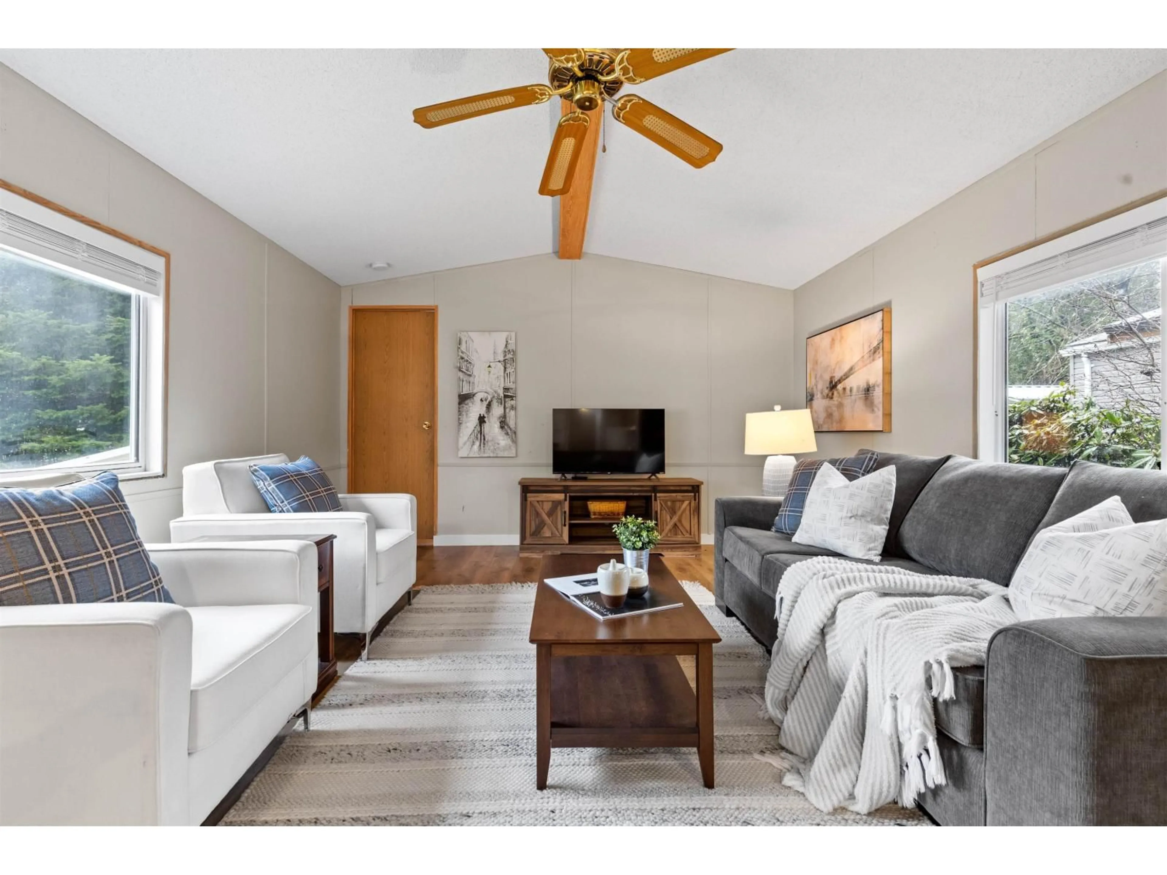 Living room with furniture, wood/laminate floor for 216 - 45835 SLEEPY HOLLOW ROAD, Cultus Lake British Columbia V2R5A7