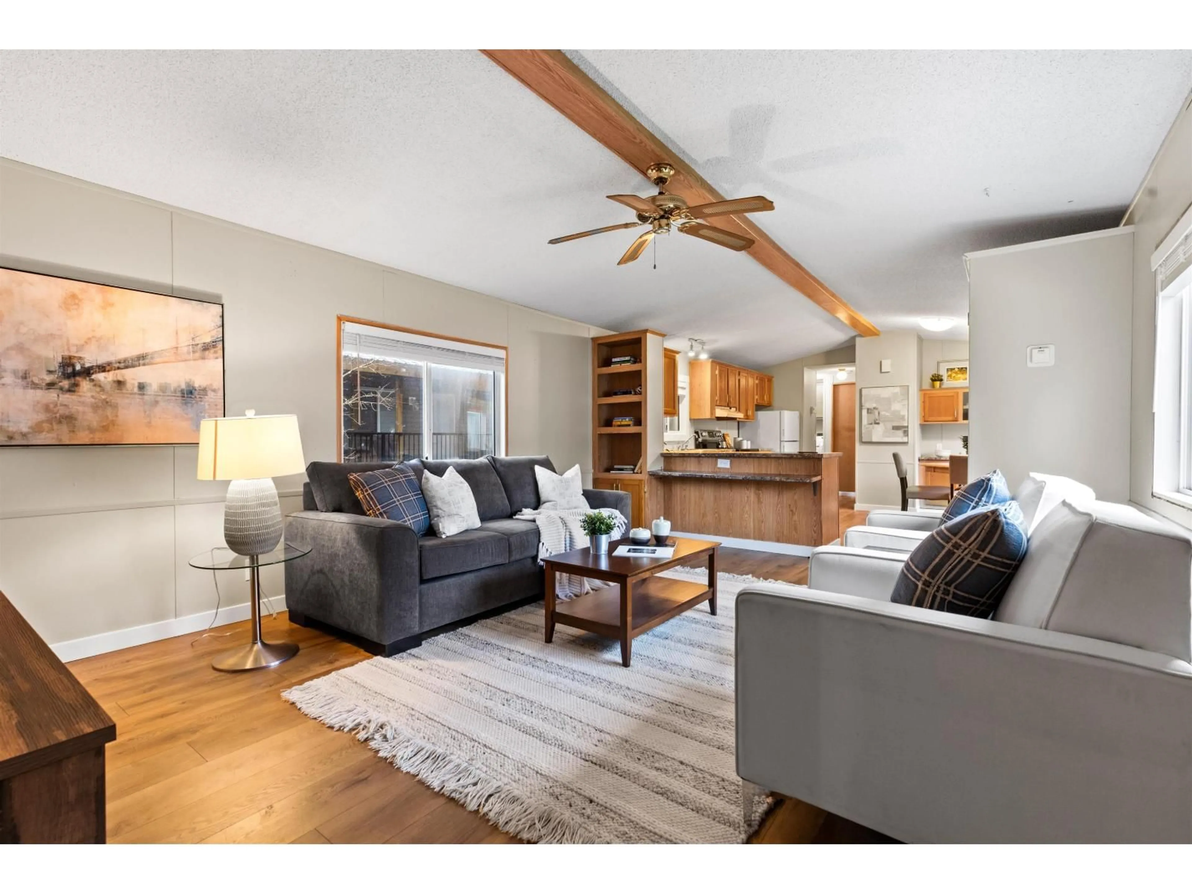 Living room with furniture, wood/laminate floor for 216 - 45835 SLEEPY HOLLOW ROAD, Cultus Lake British Columbia V2R5A7