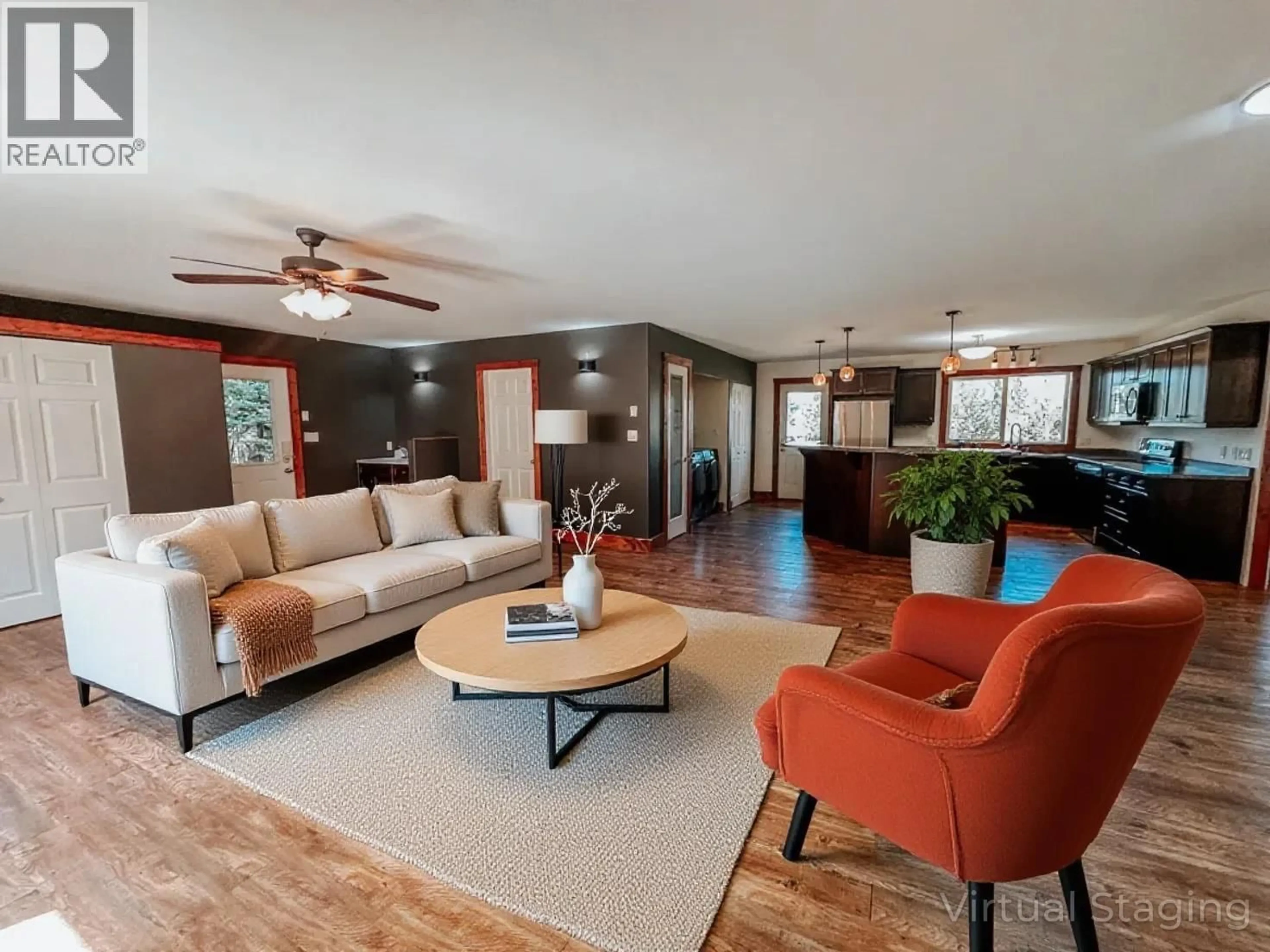 Living room with furniture, wood/laminate floor for 7604 WOMACK ROAD, Deka Lake / Sulphurous / Hathaway Lakes British Columbia V0K1X3