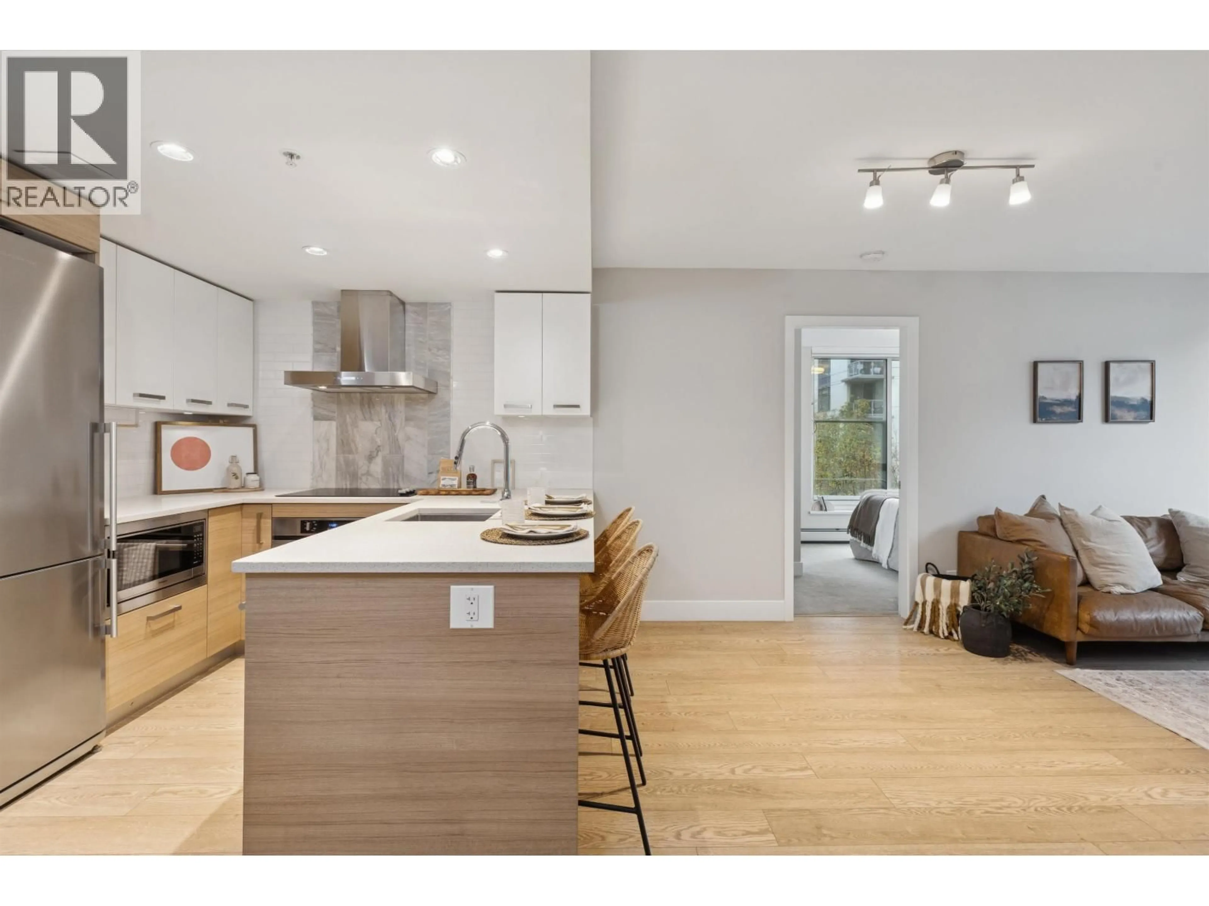 Open concept kitchen, wood/laminate floor for 329 - 1783 MANITOBA STREET, Vancouver British Columbia V5Y0K1