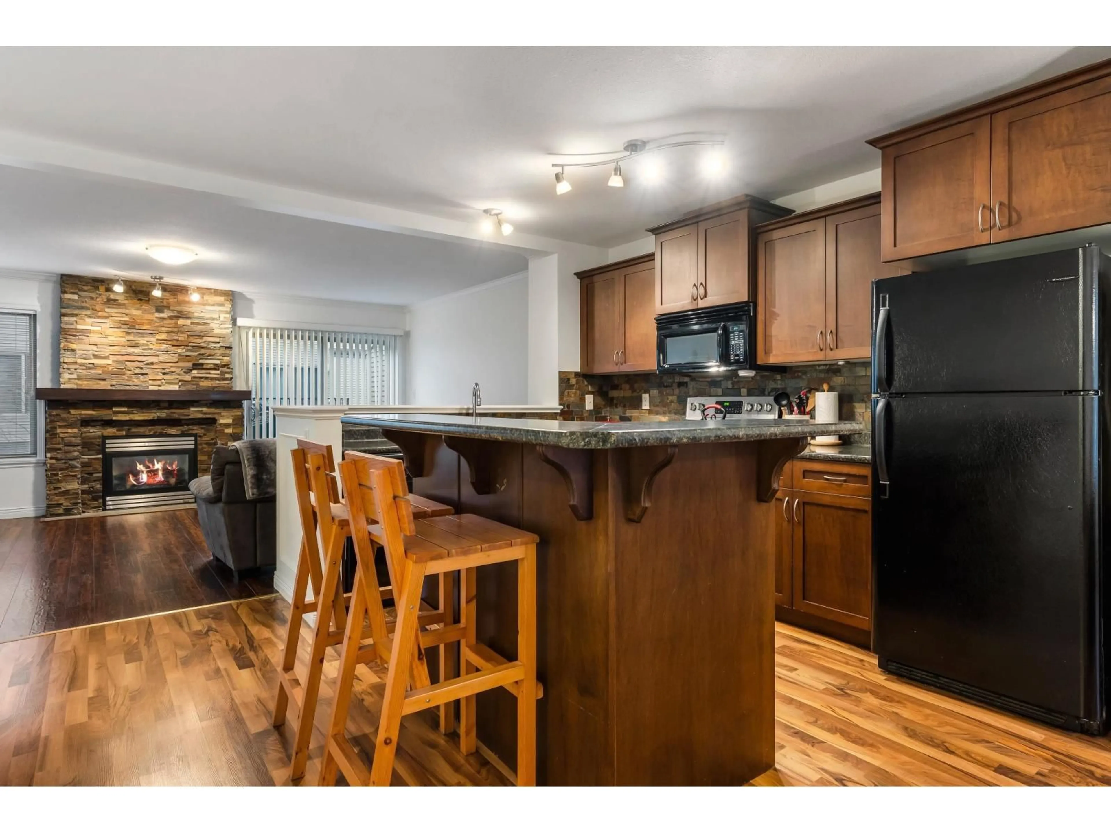 Open concept kitchen, wood/laminate floor for 66 - 5556 PEACH ROAD, Chilliwack British Columbia V2R5X4