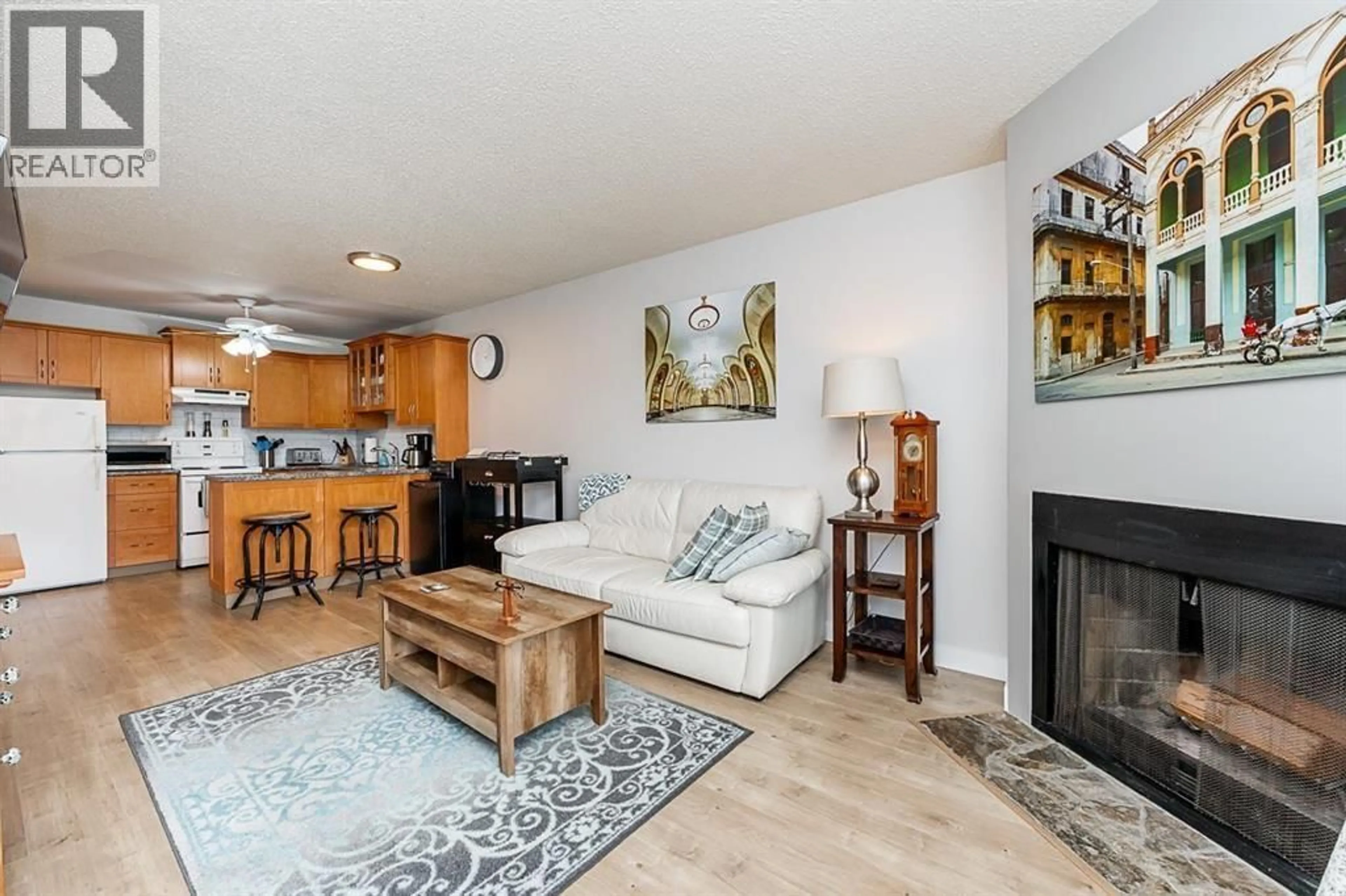 Living room with furniture, wood/laminate floor for 307 - 1122 KING ALBERT AVENUE, Coquitlam British Columbia V3J1X7