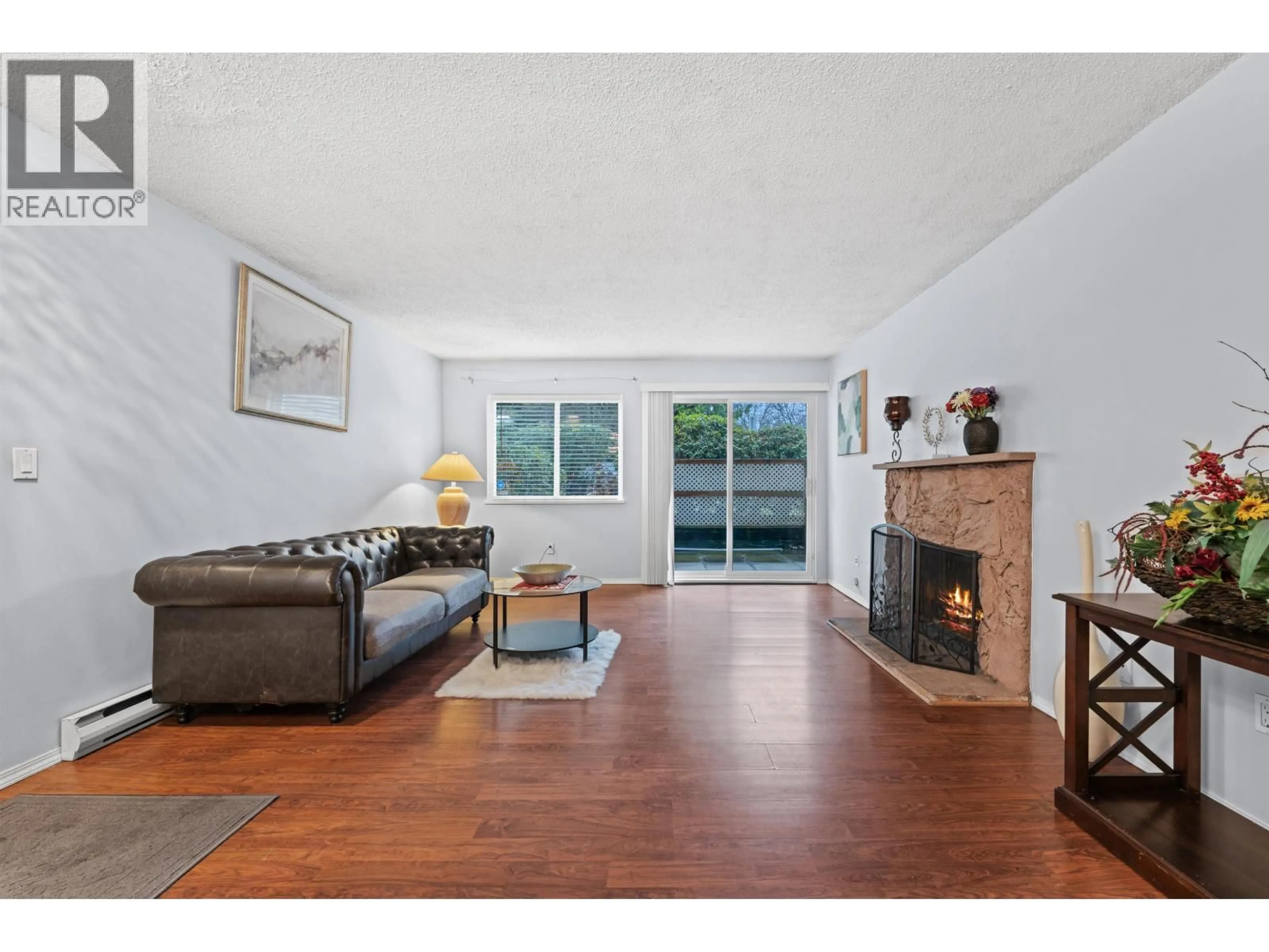 Living room with furniture, wood/laminate floor for 119 - 555 NORTH ROAD, Coquitlam British Columbia V3J1N8