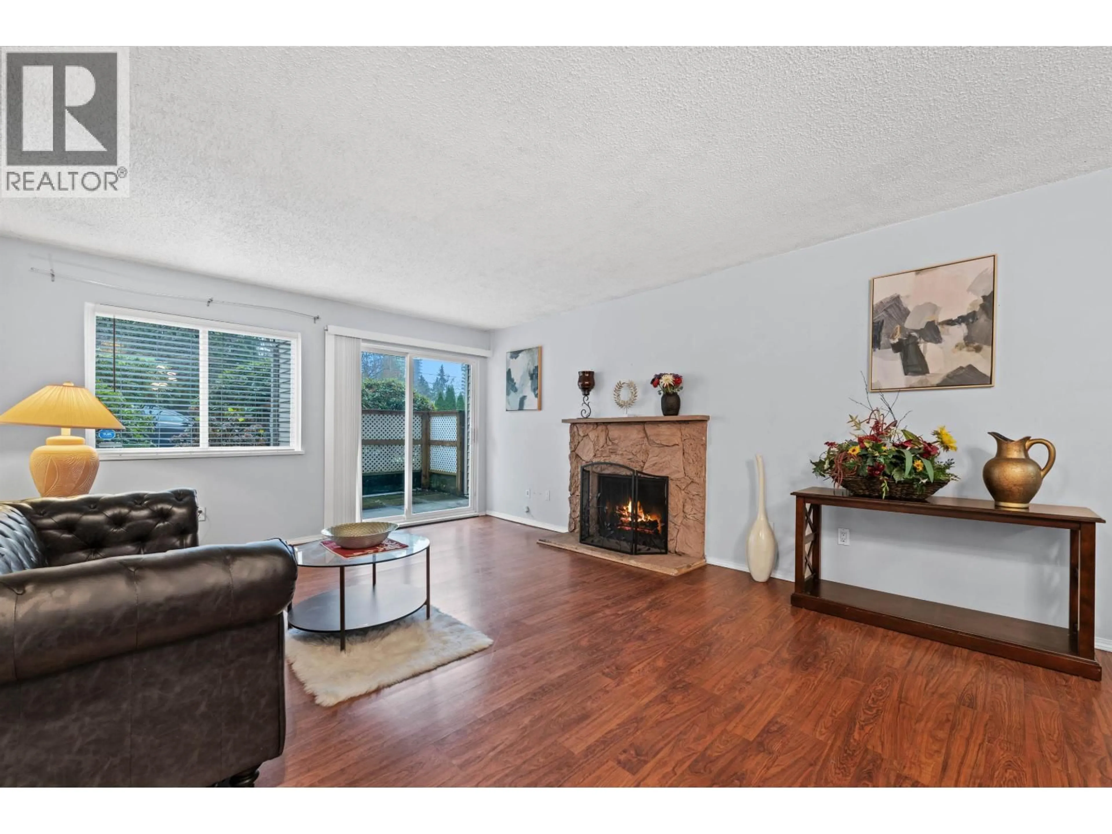 Living room with furniture, wood/laminate floor for 119 - 555 NORTH ROAD, Coquitlam British Columbia V3J1N8
