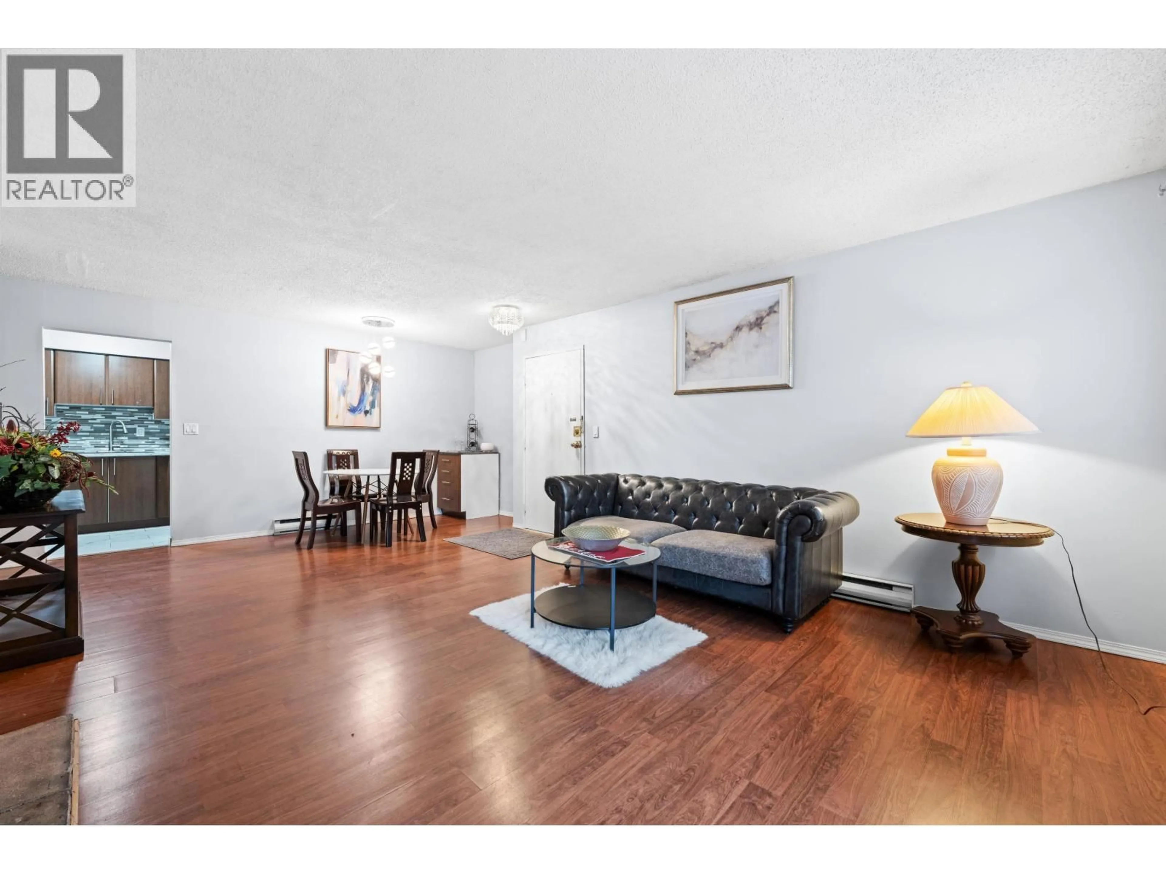 Living room with furniture, wood/laminate floor for 119 - 555 NORTH ROAD, Coquitlam British Columbia V3J1N8