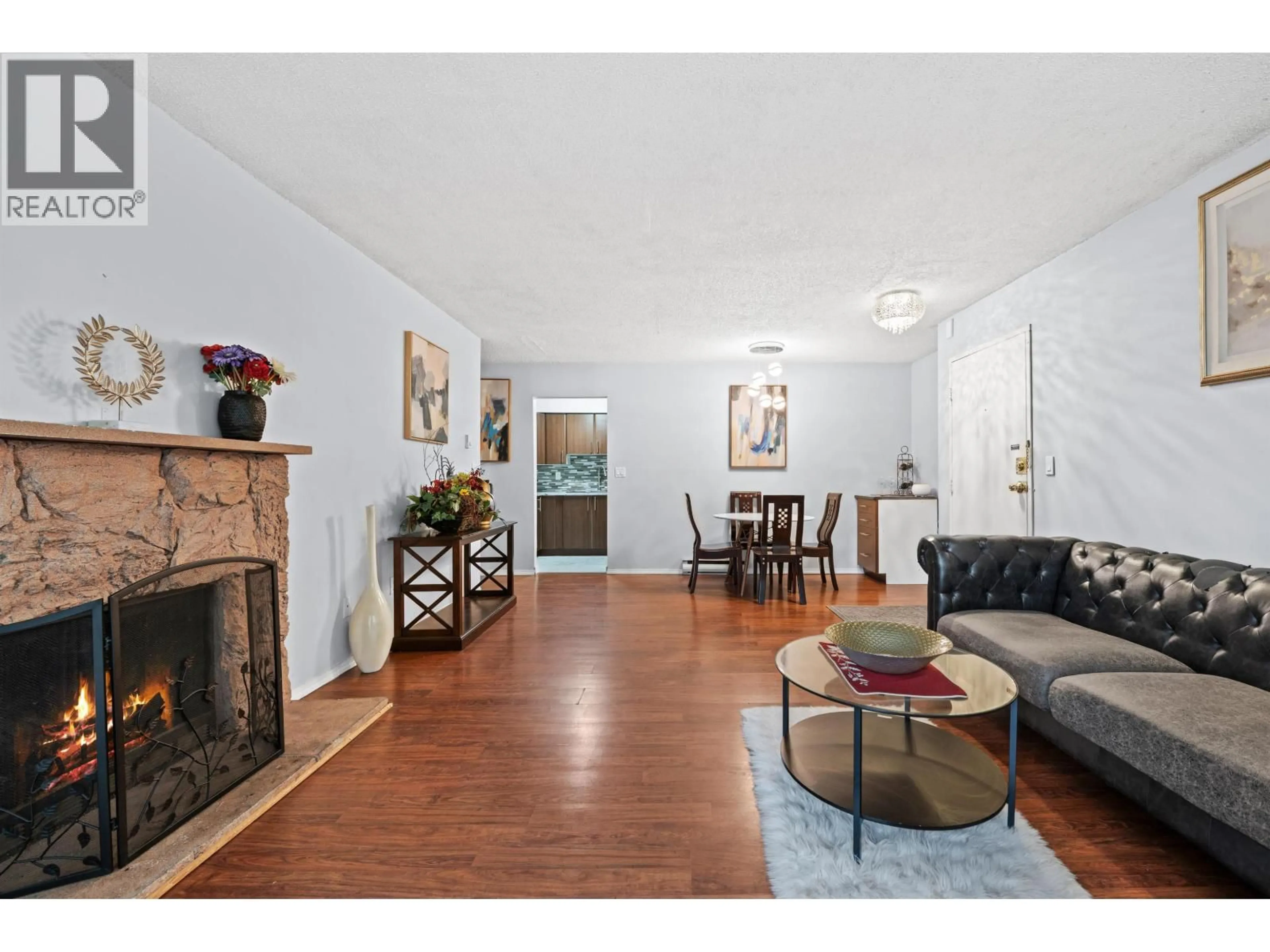 Living room with furniture, wood/laminate floor for 119 - 555 NORTH ROAD, Coquitlam British Columbia V3J1N8