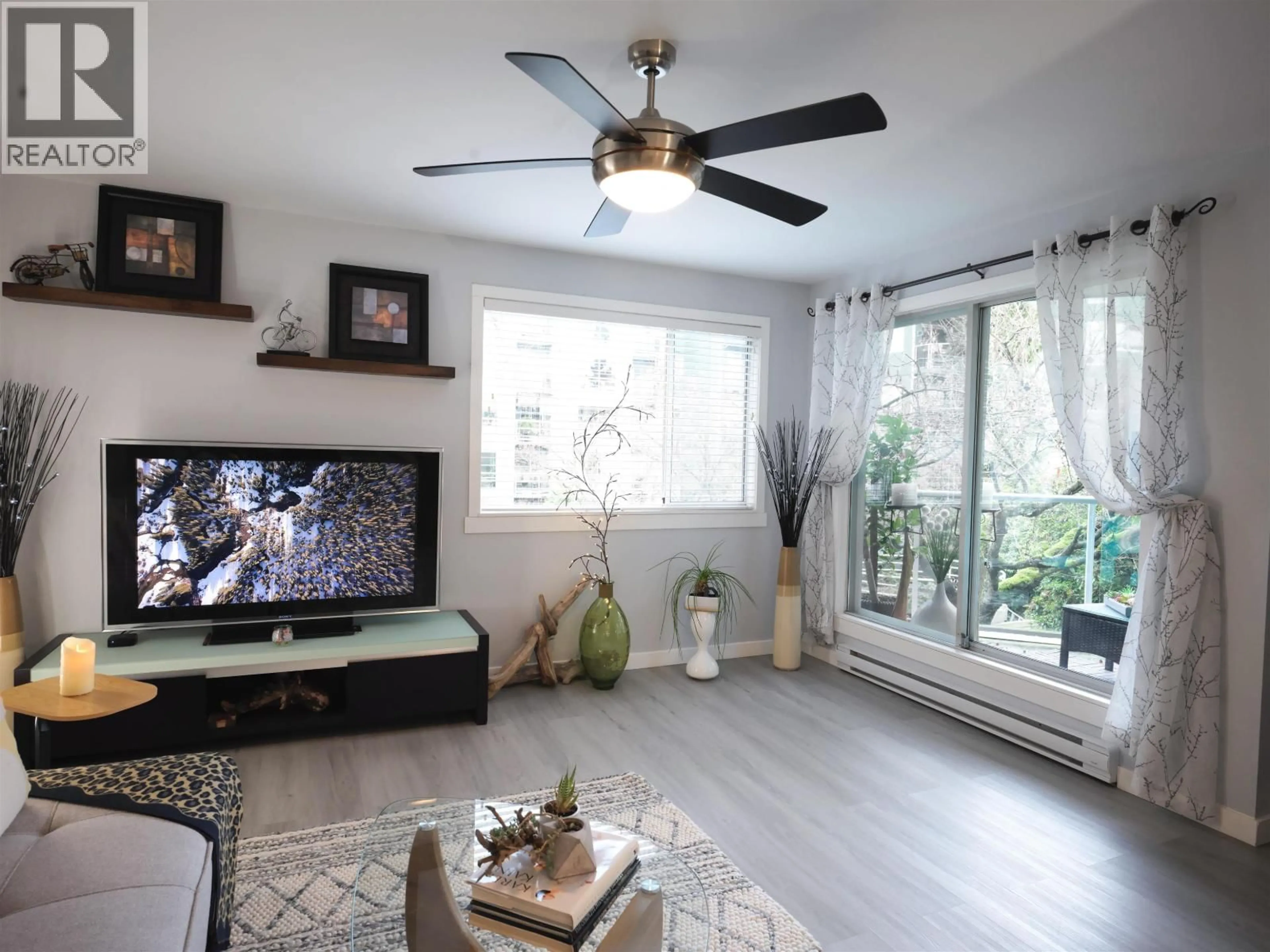 Living room with furniture, wood/laminate floor for 204 - 1550 MARINER WALK, Vancouver British Columbia V6J4X9