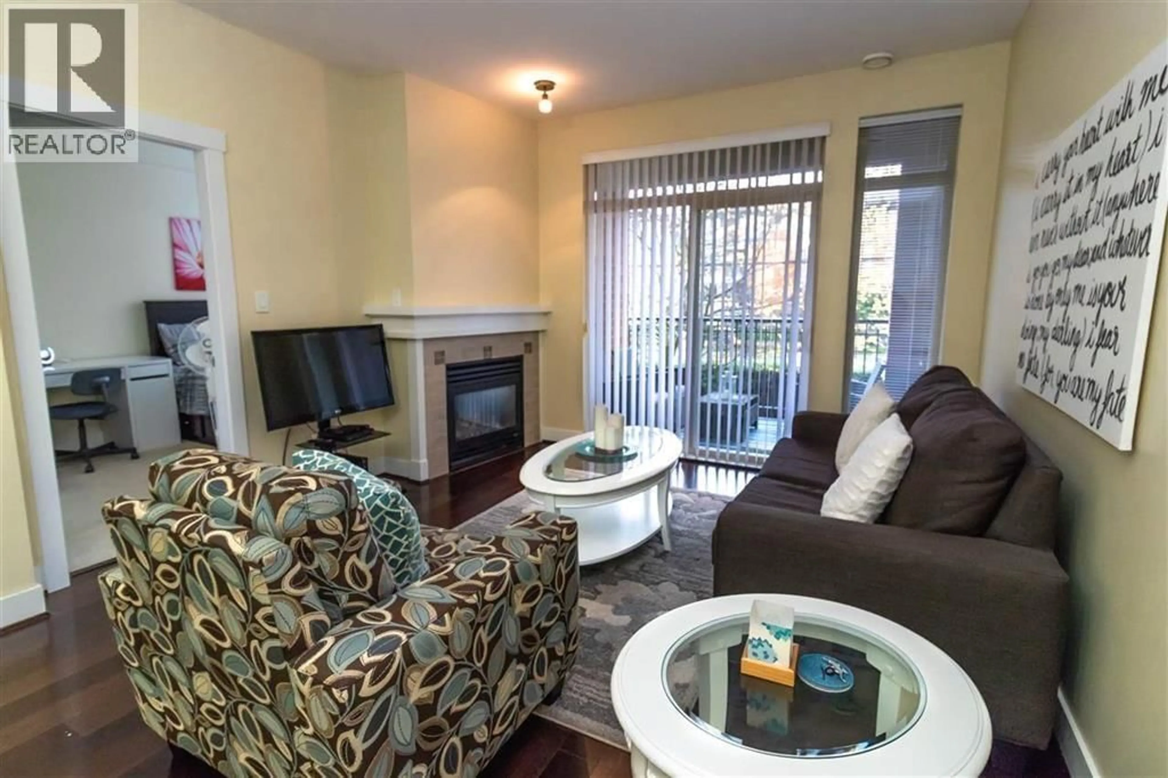 Living room with furniture, wood/laminate floor for 208 - 2280 WESBROOK MALL, Vancouver British Columbia V6T2K3