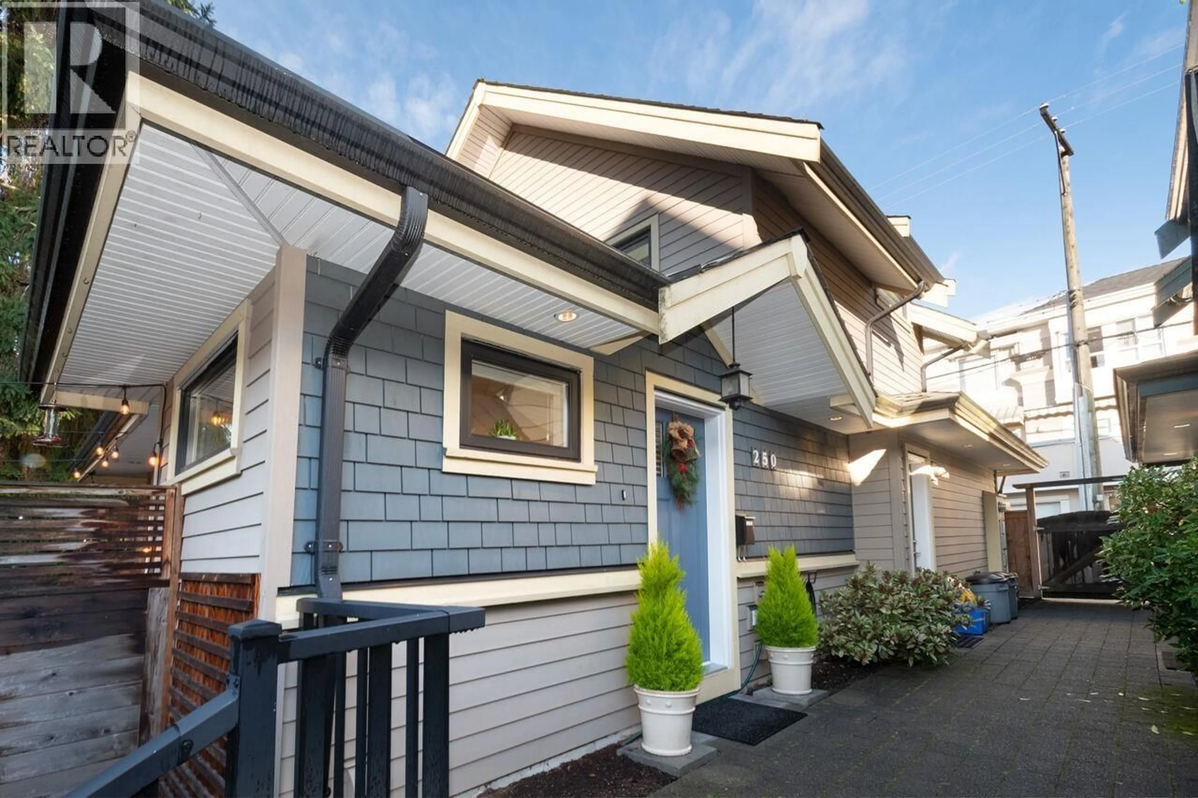Home with vinyl exterior material, street for 250 10TH STREET, North Vancouver British Columbia V7L2E1