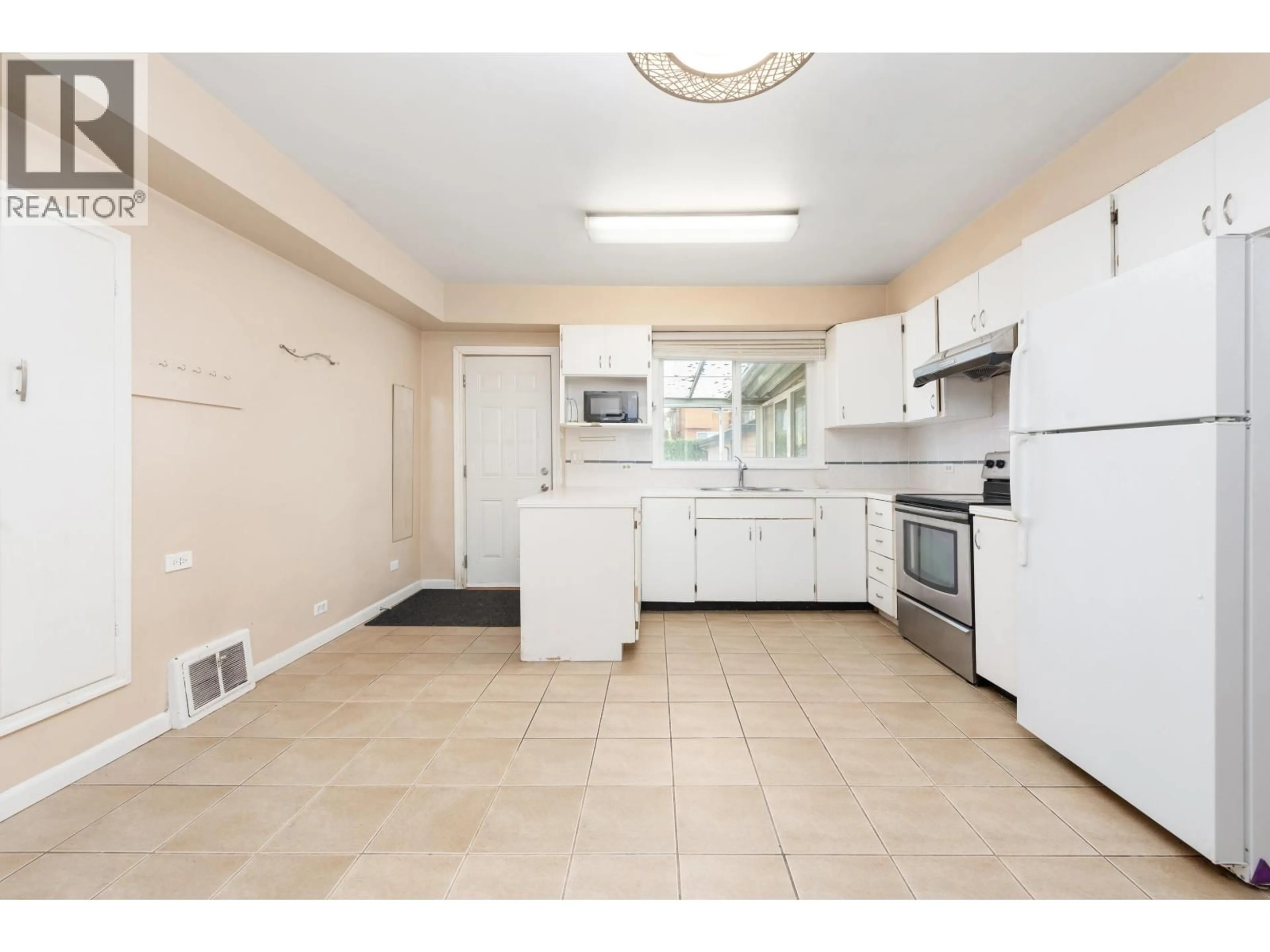 Standard kitchen, ceramic/tile floor for 5556 EARLES STREET, Vancouver British Columbia V5R3S1
