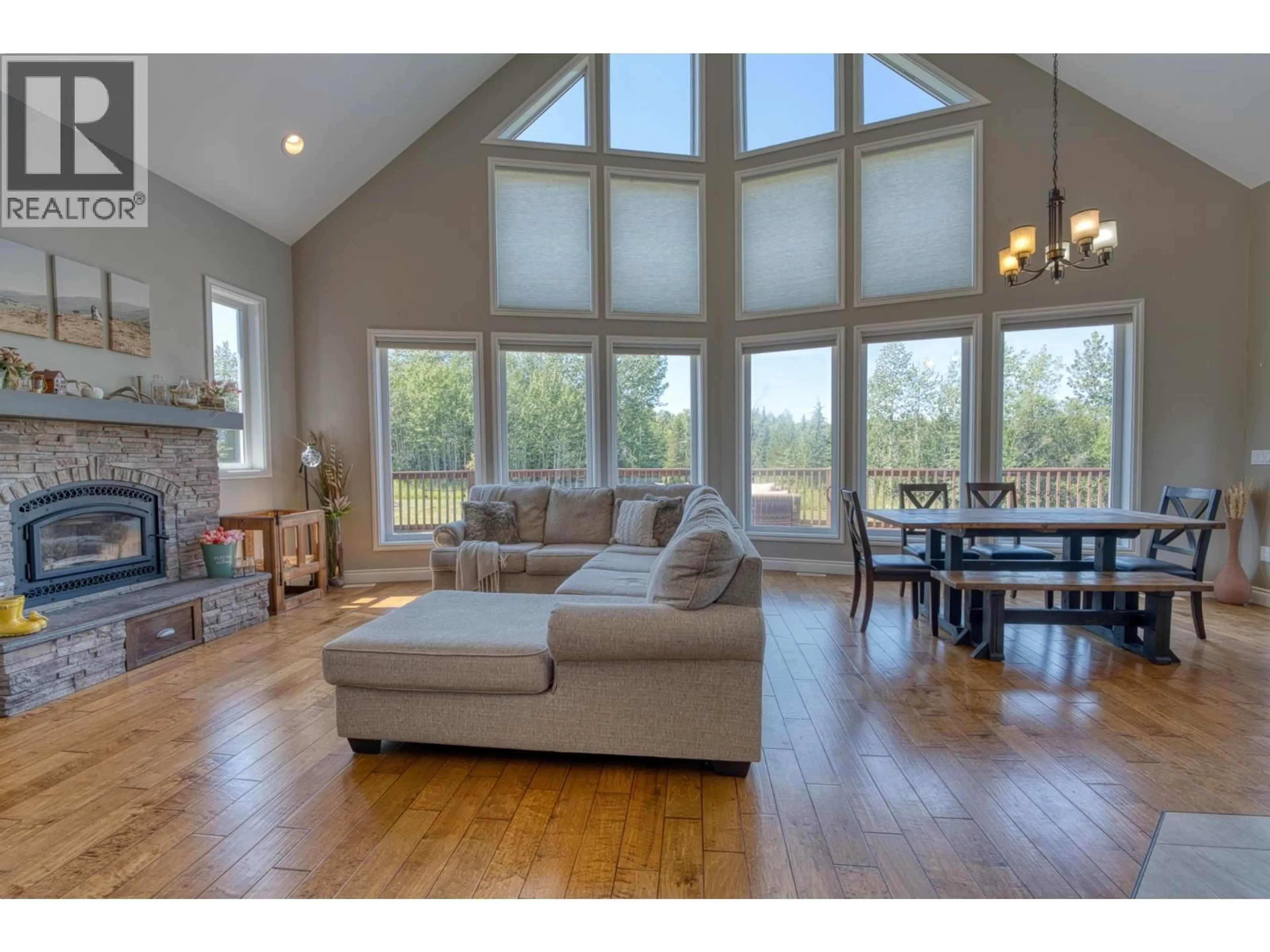 Living room with furniture, wood/laminate floor for 13628 281 ROAD, Fort St. John British Columbia V1J8J4