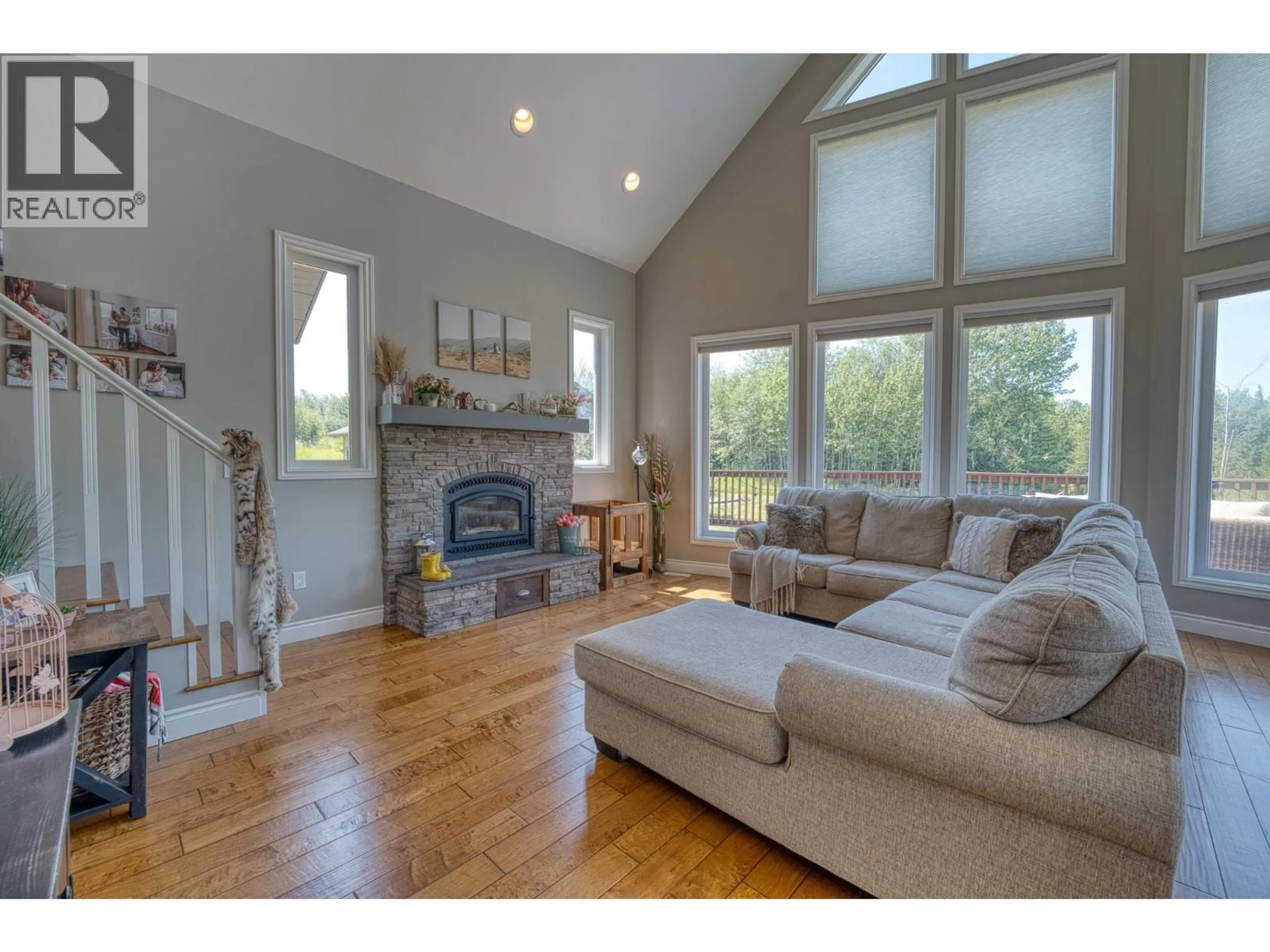Living room with furniture, wood/laminate floor for 13628 281 ROAD, Fort St. John British Columbia V1J8J4