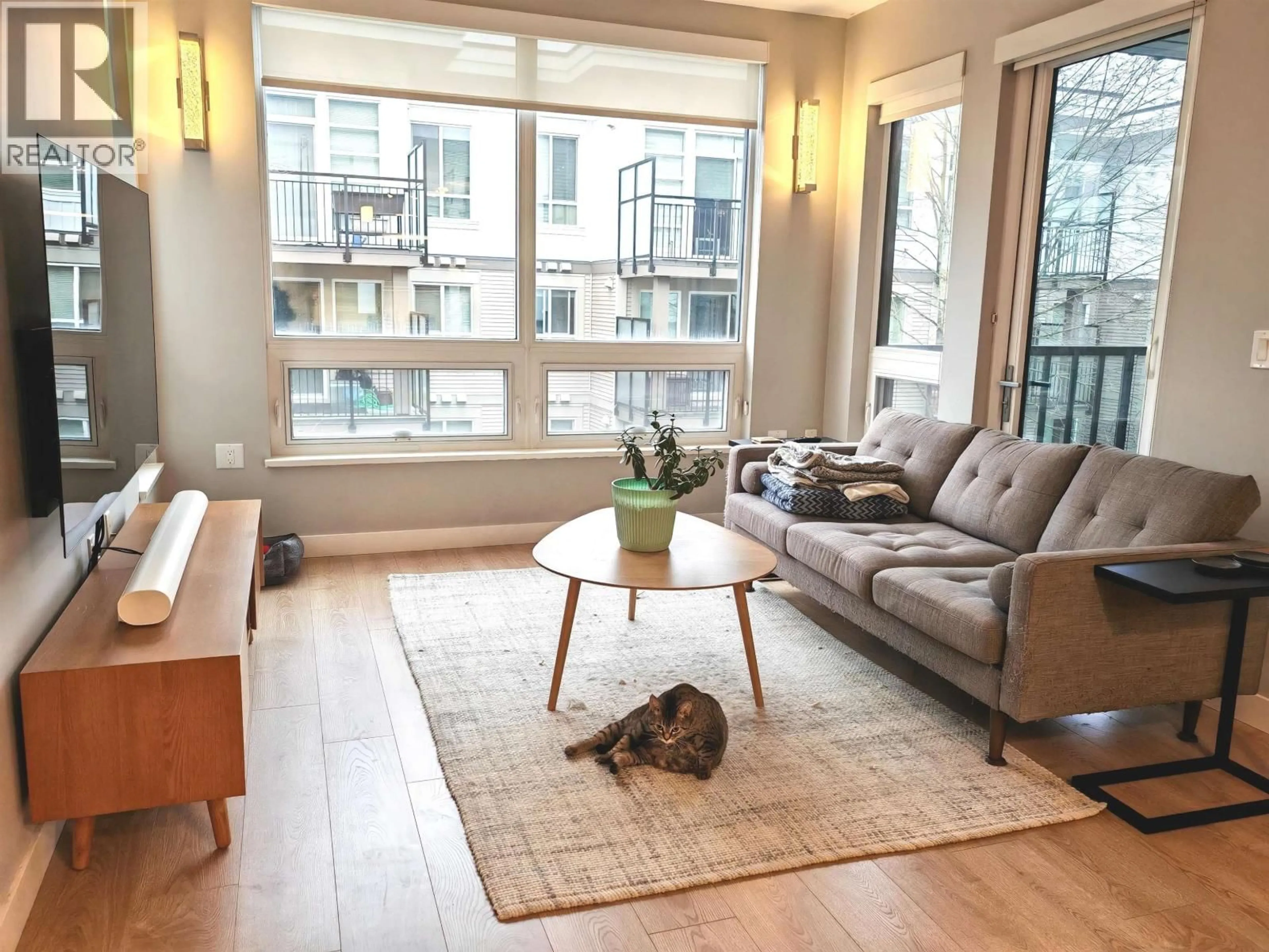 Living room with furniture, wood/laminate floor for 305 - 9388 ODLIN ROAD, Richmond British Columbia V6X0L5