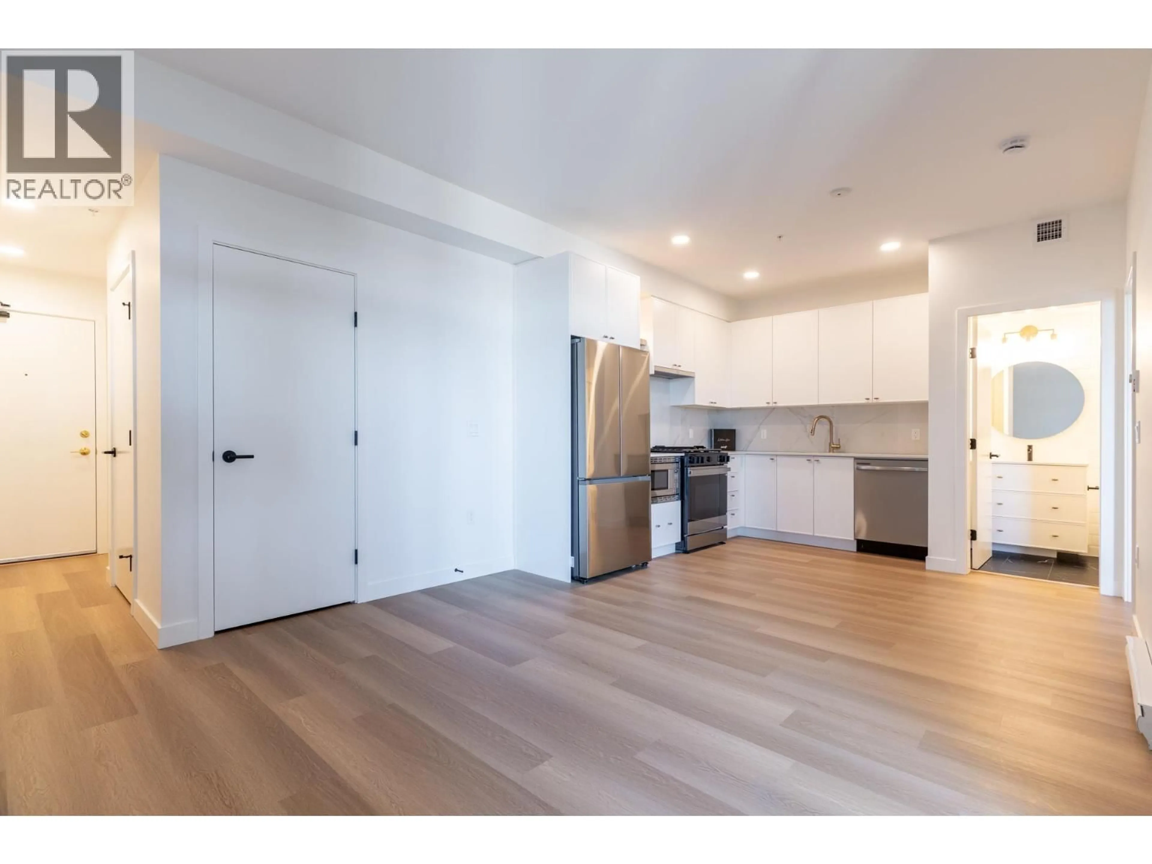 Open concept kitchen, wood/laminate floor for 616 - 215 MCBAY LANE, Coquitlam British Columbia V3K0H7