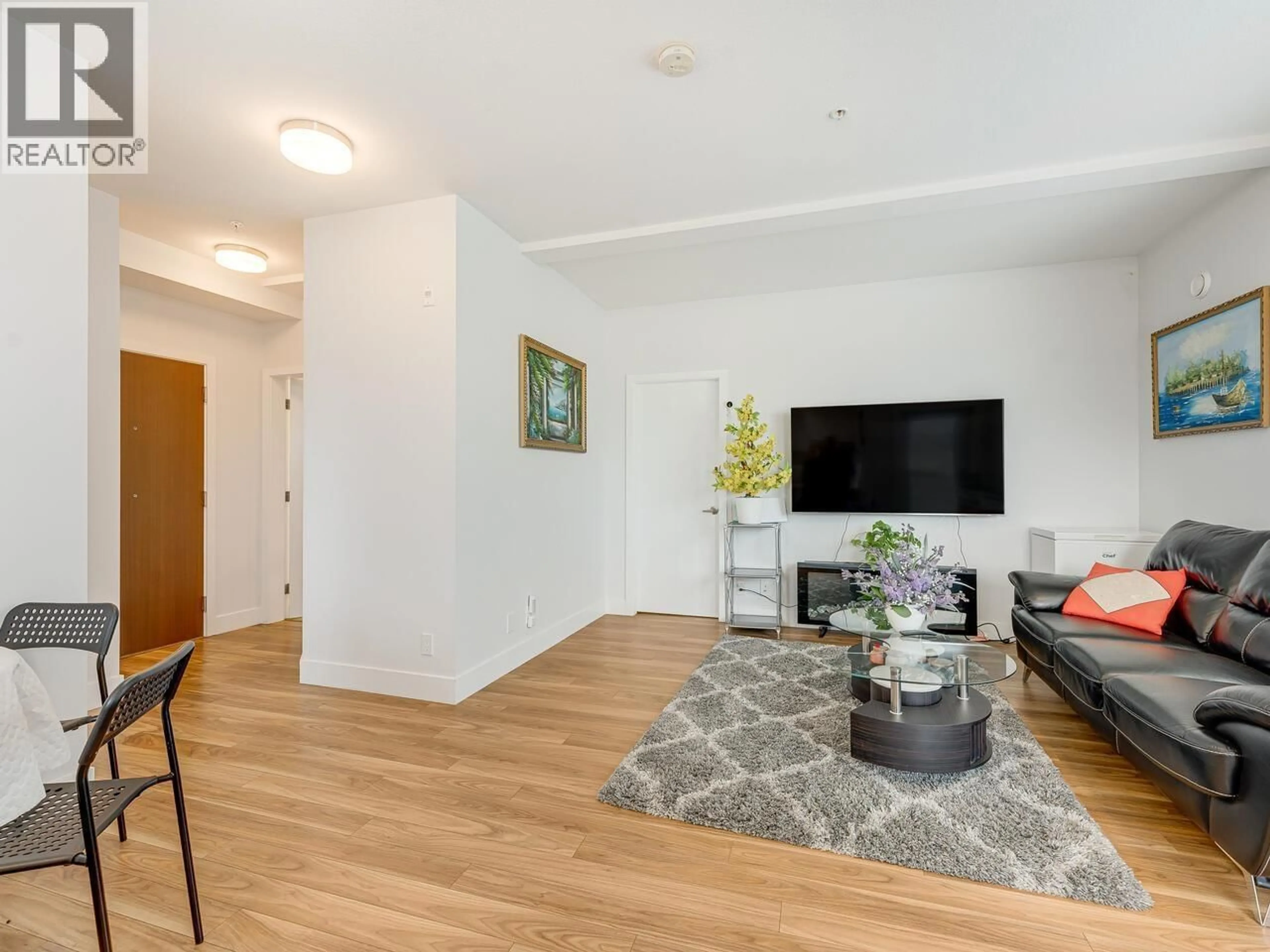 Living room with furniture, wood/laminate floor for 212 - 5355 LANE STREET, Burnaby British Columbia V5H0H1