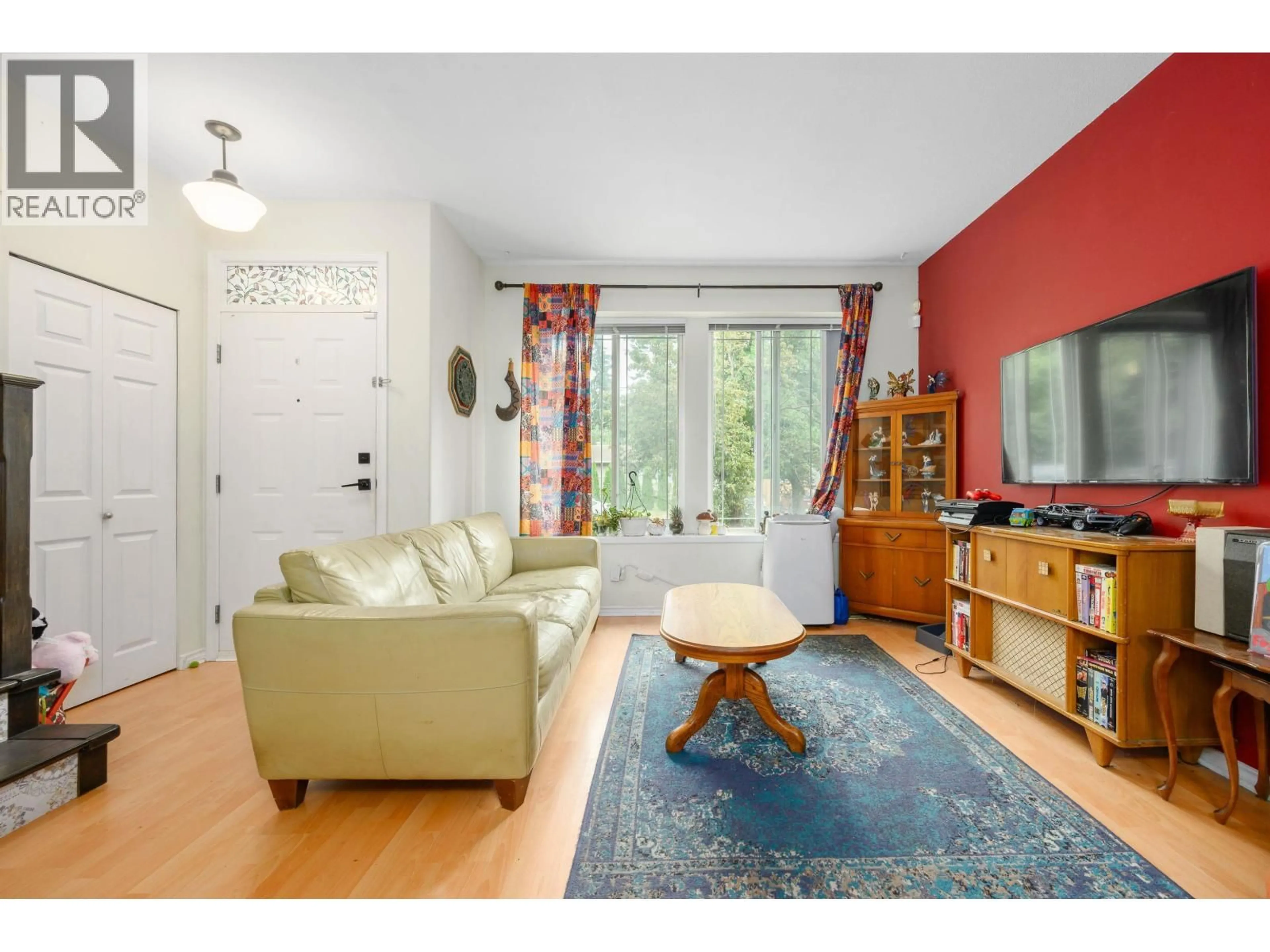 Living room with furniture, wood/laminate floor for 24113 102 AVENUE, Maple Ridge British Columbia V2W2A2