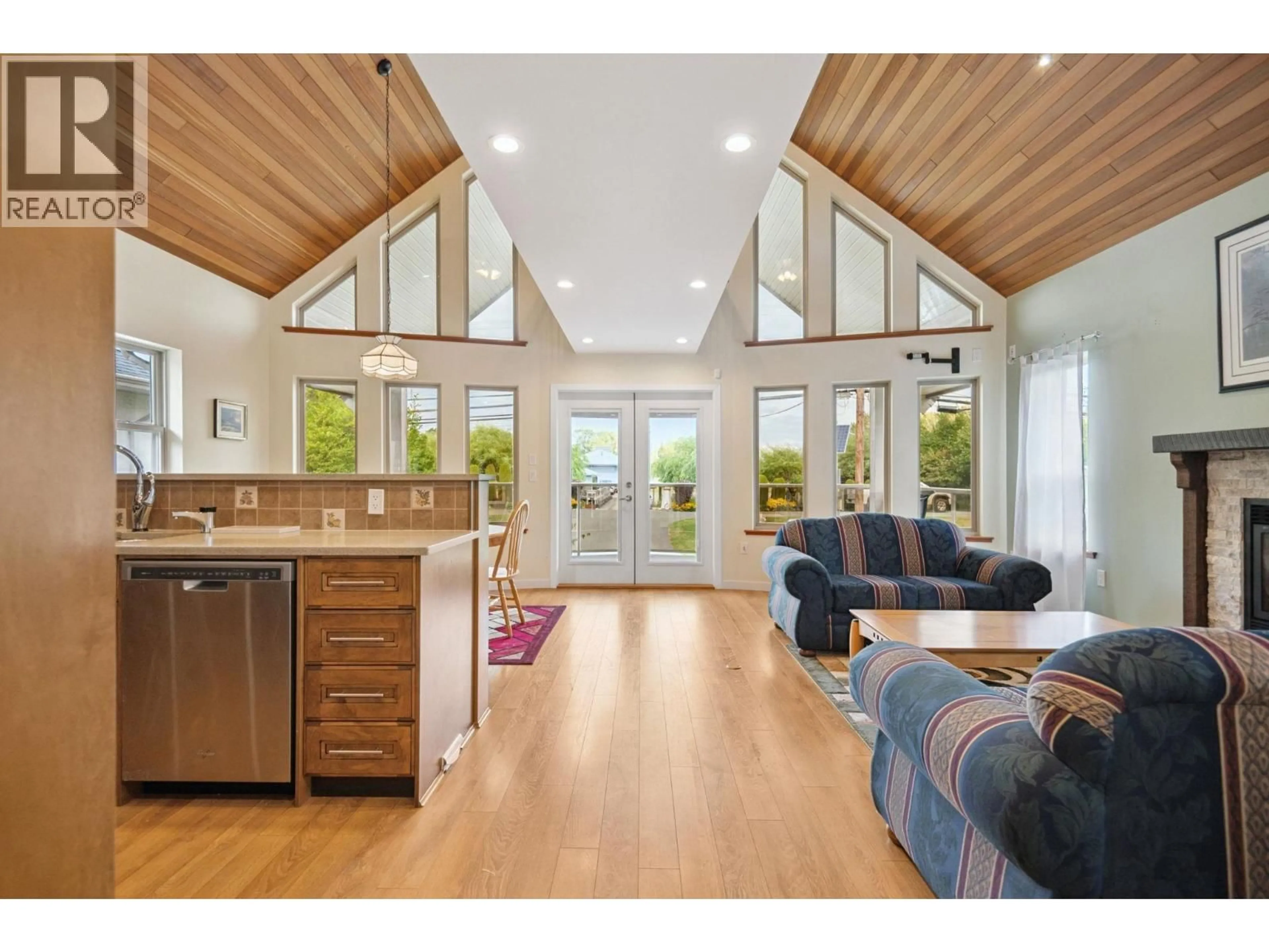 Open concept kitchen, wood/laminate floor for 4394 RIVER ROAD, Delta British Columbia V4K1S2