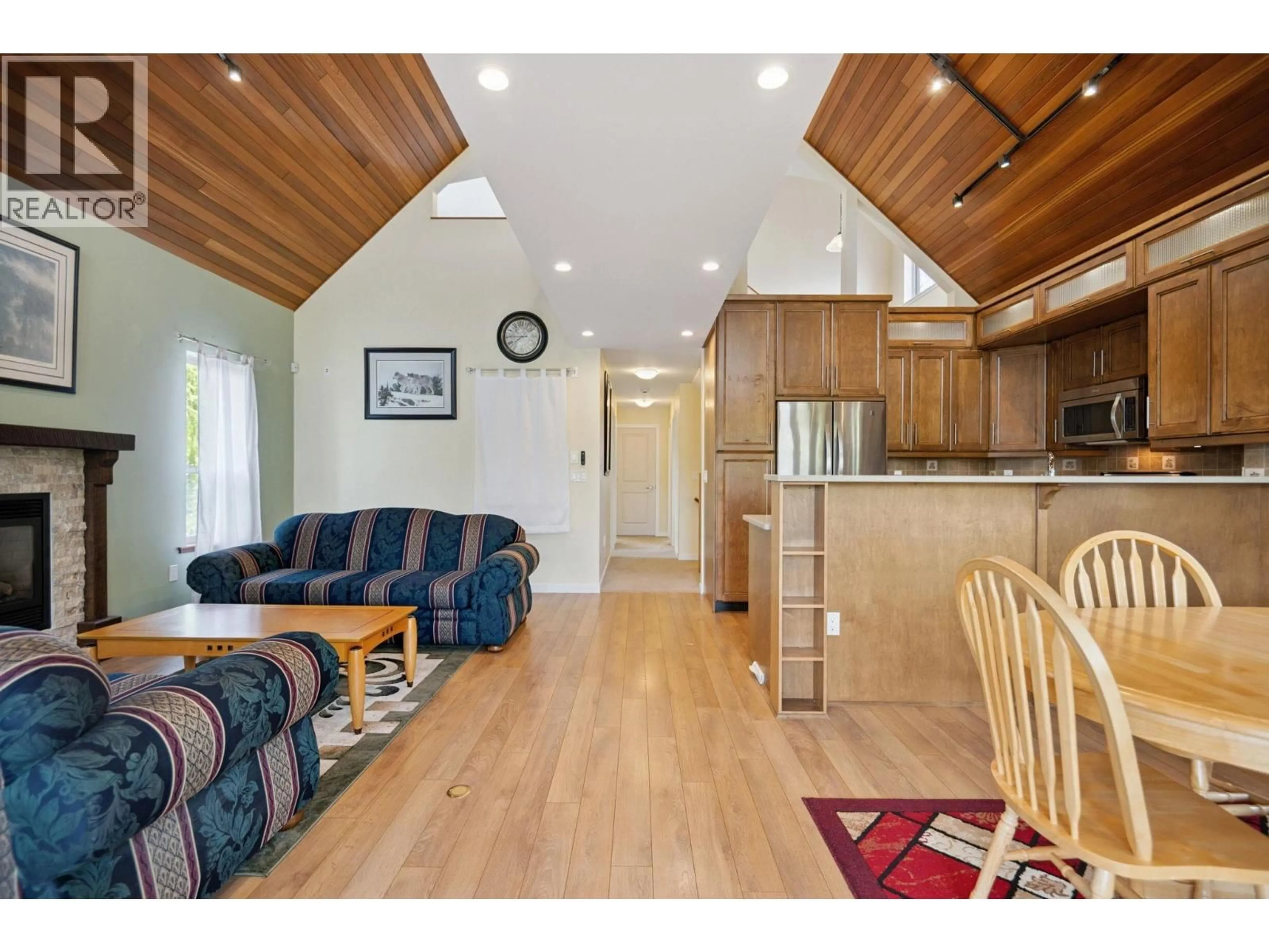 Open concept kitchen, wood/laminate floor for 4394 RIVER ROAD, Delta British Columbia V4K1S2