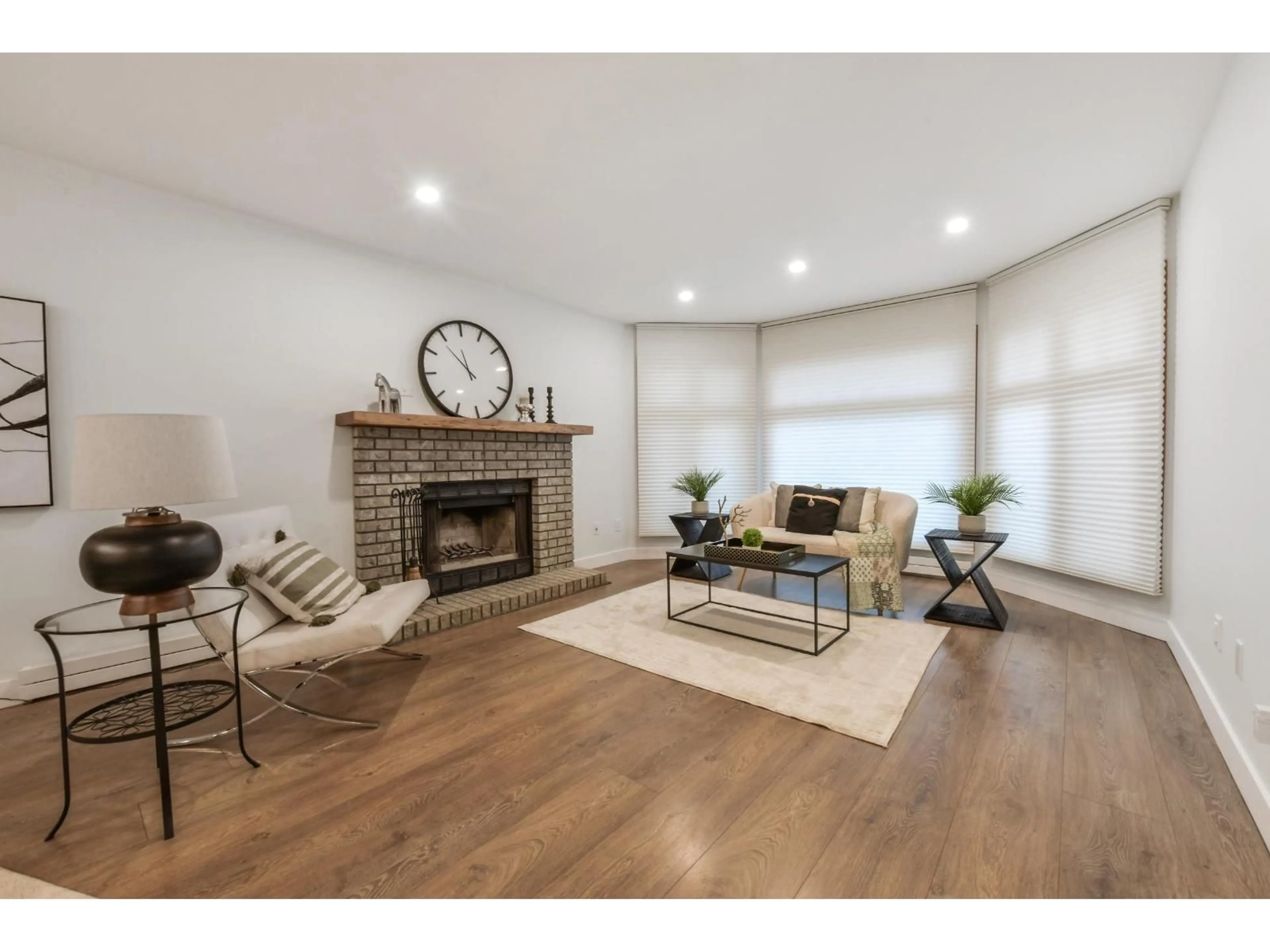 Living room with furniture, wood/laminate floor for 6035 172B STREET, Surrey British Columbia V3S6G6