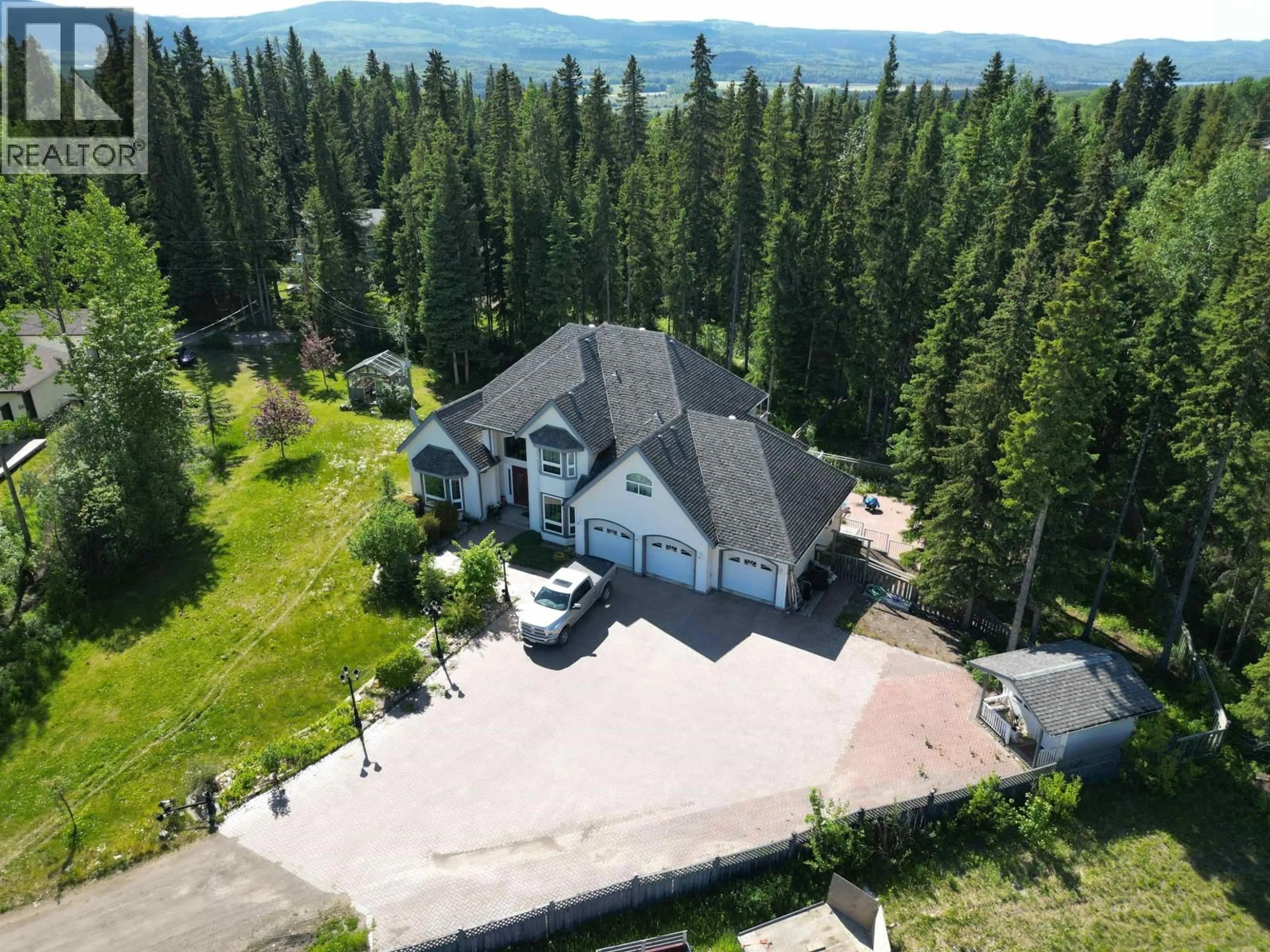 A pic from outside/outdoor area/front of a property/back of a property/a pic from drone, mountain view for 585 5TH AVENUE, Burns Lake British Columbia V0J1E0