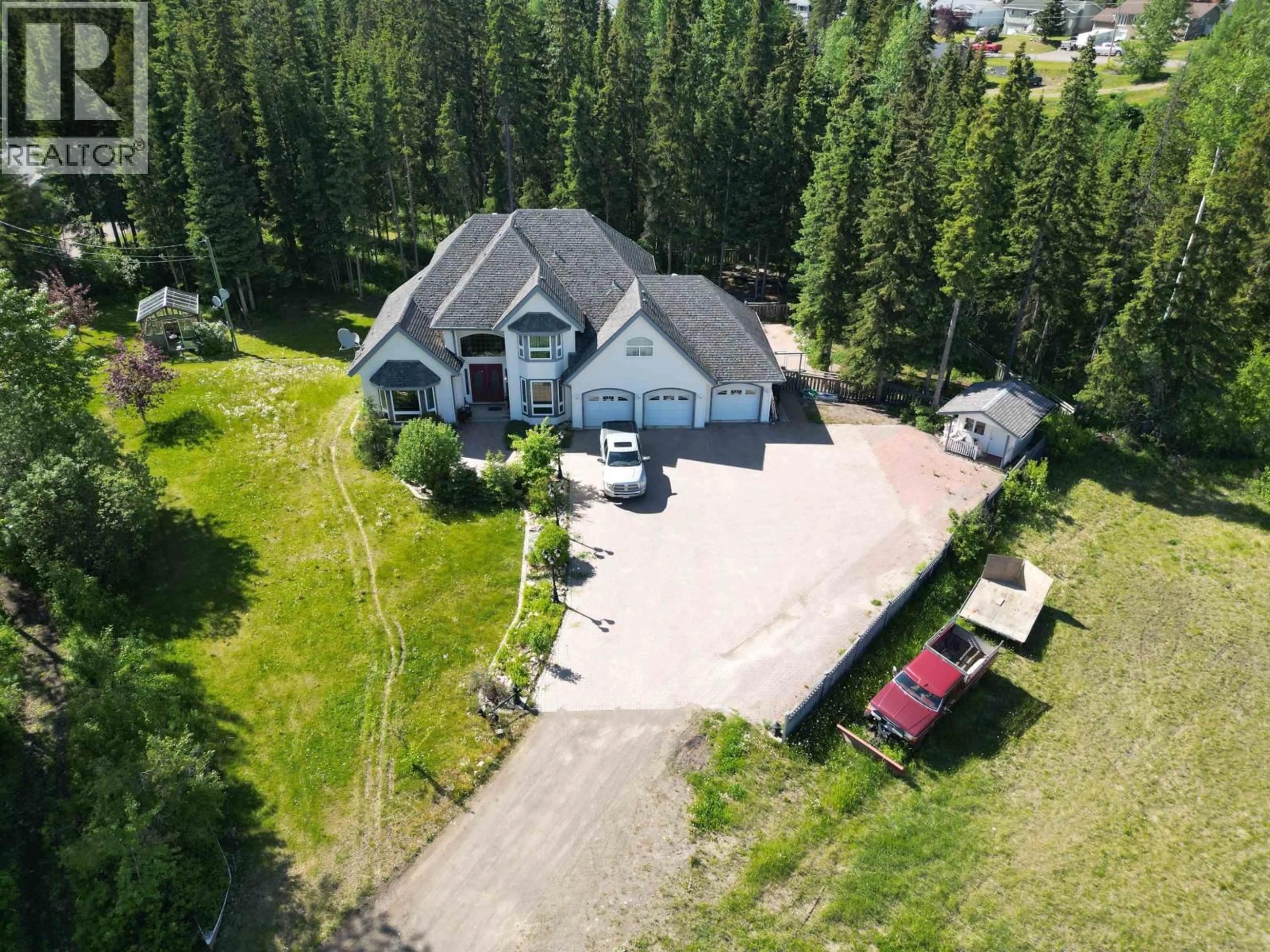 A pic from outside/outdoor area/front of a property/back of a property/a pic from drone, mountain view for 585 5TH AVENUE, Burns Lake British Columbia V0J1E0