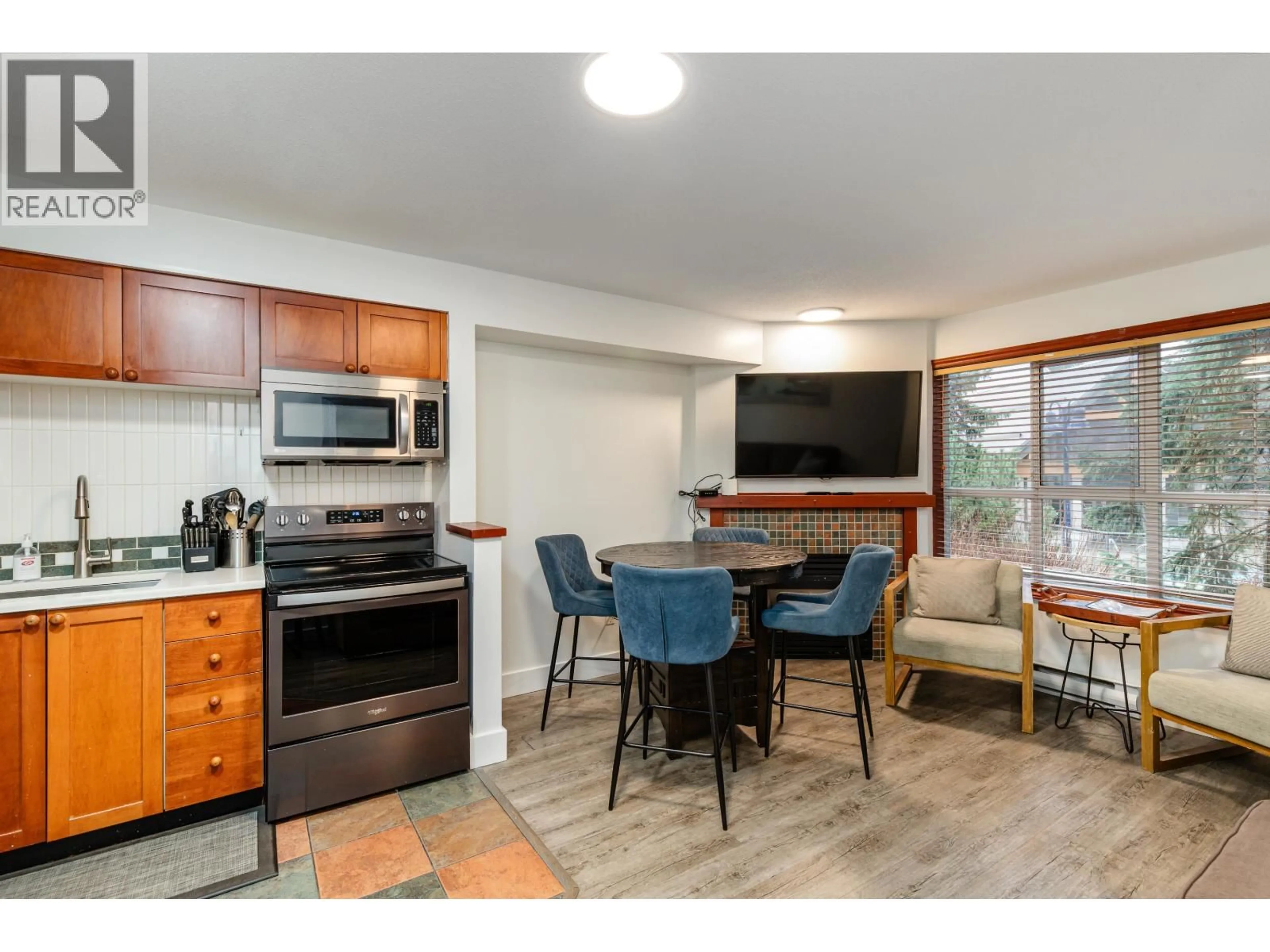 Open concept kitchen, wood/laminate floor for 24/24A - 4388 NORTHLANDS BOULEVARD, Whistler British Columbia V8E1C6
