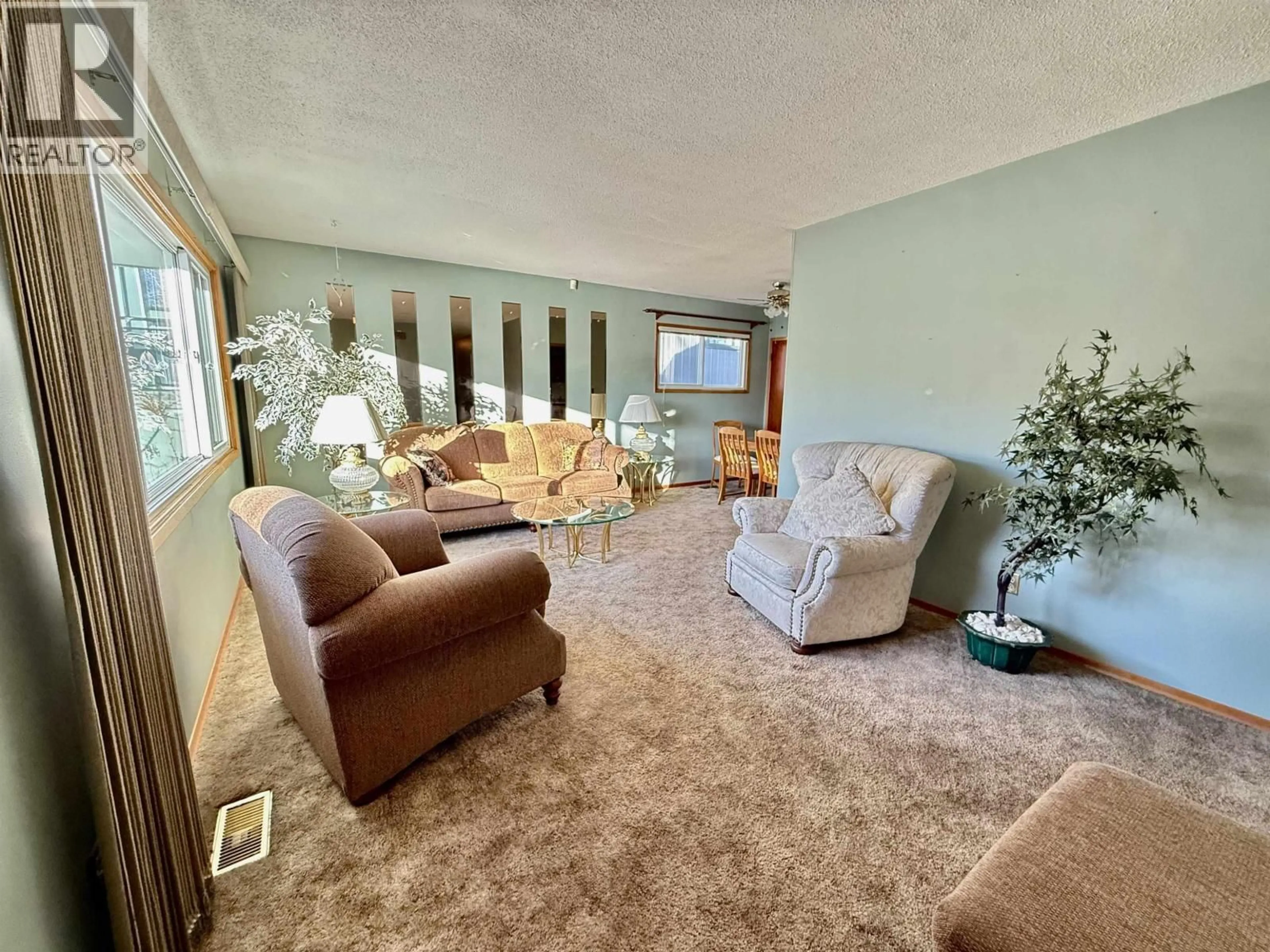 Living room with furniture, carpet floor for 1676 7TH AVENUE, Prince George British Columbia V2L3P6