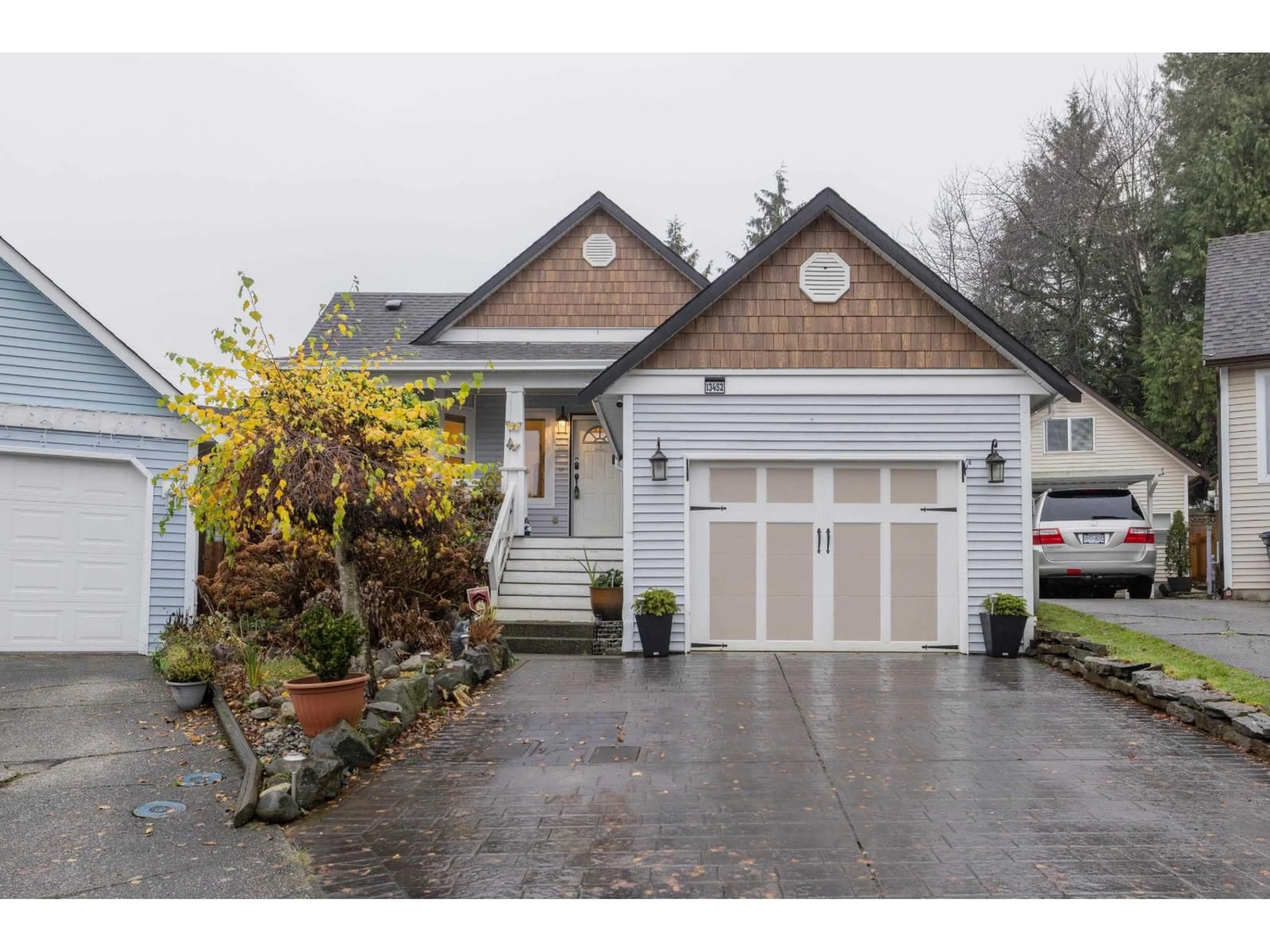 Home with vinyl exterior material, street for 13452 62A AVENUE, Surrey British Columbia V3X1K4