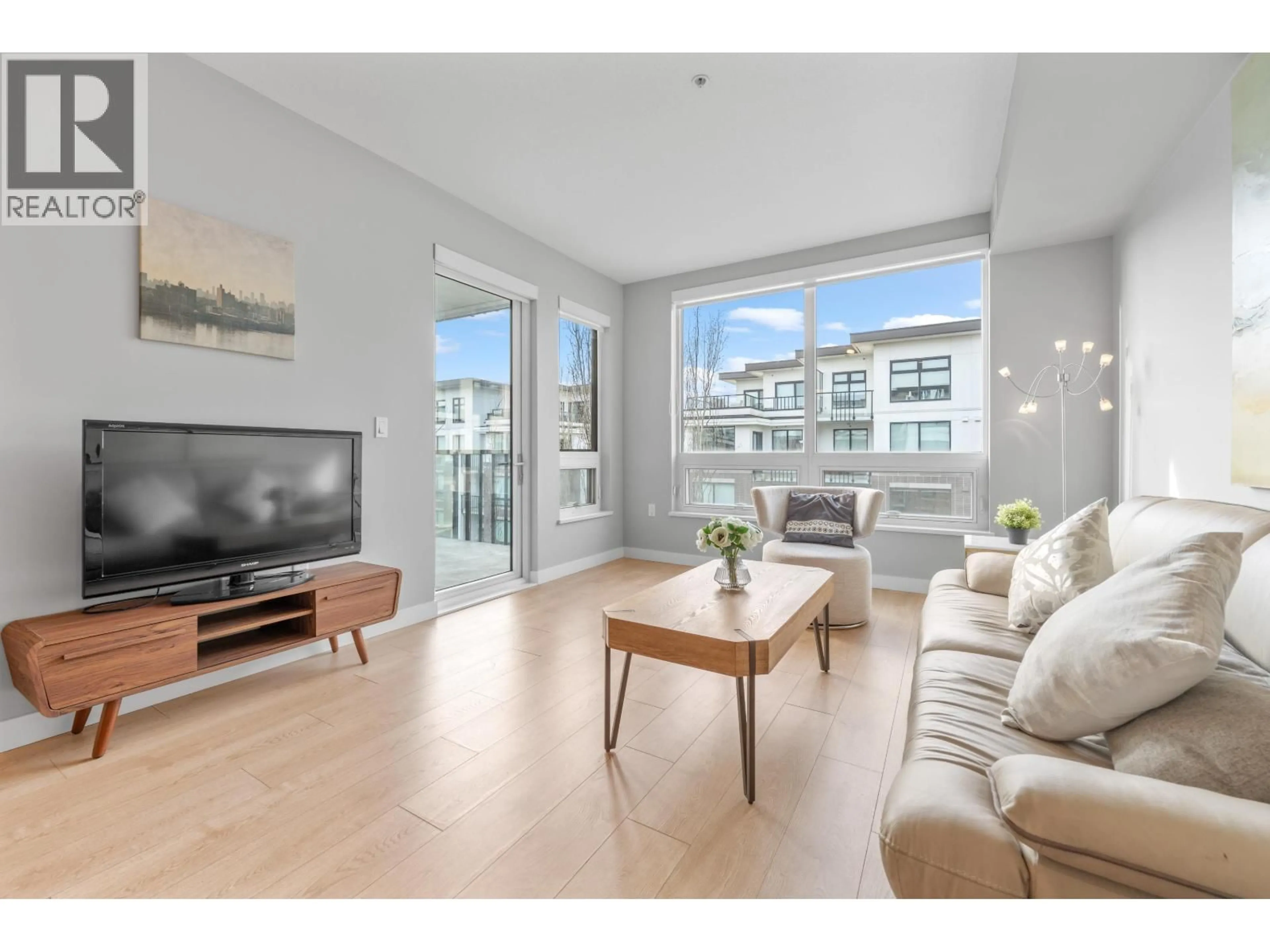 Living room with furniture, wood/laminate floor for 311 - 9388 ODLIN ROAD, Richmond British Columbia V6X0L5