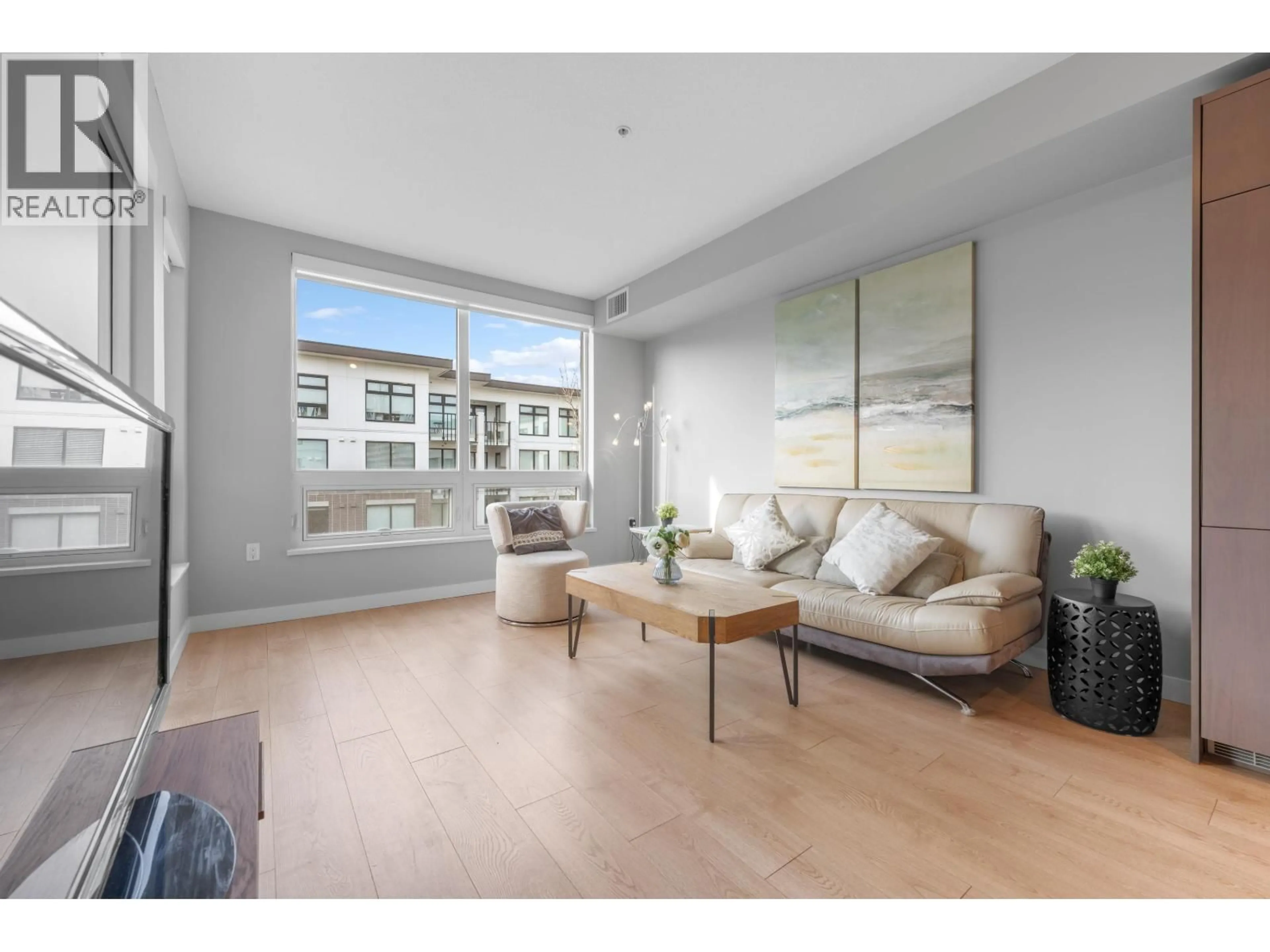 Living room with furniture, wood/laminate floor for 311 - 9388 ODLIN ROAD, Richmond British Columbia V6X0L5