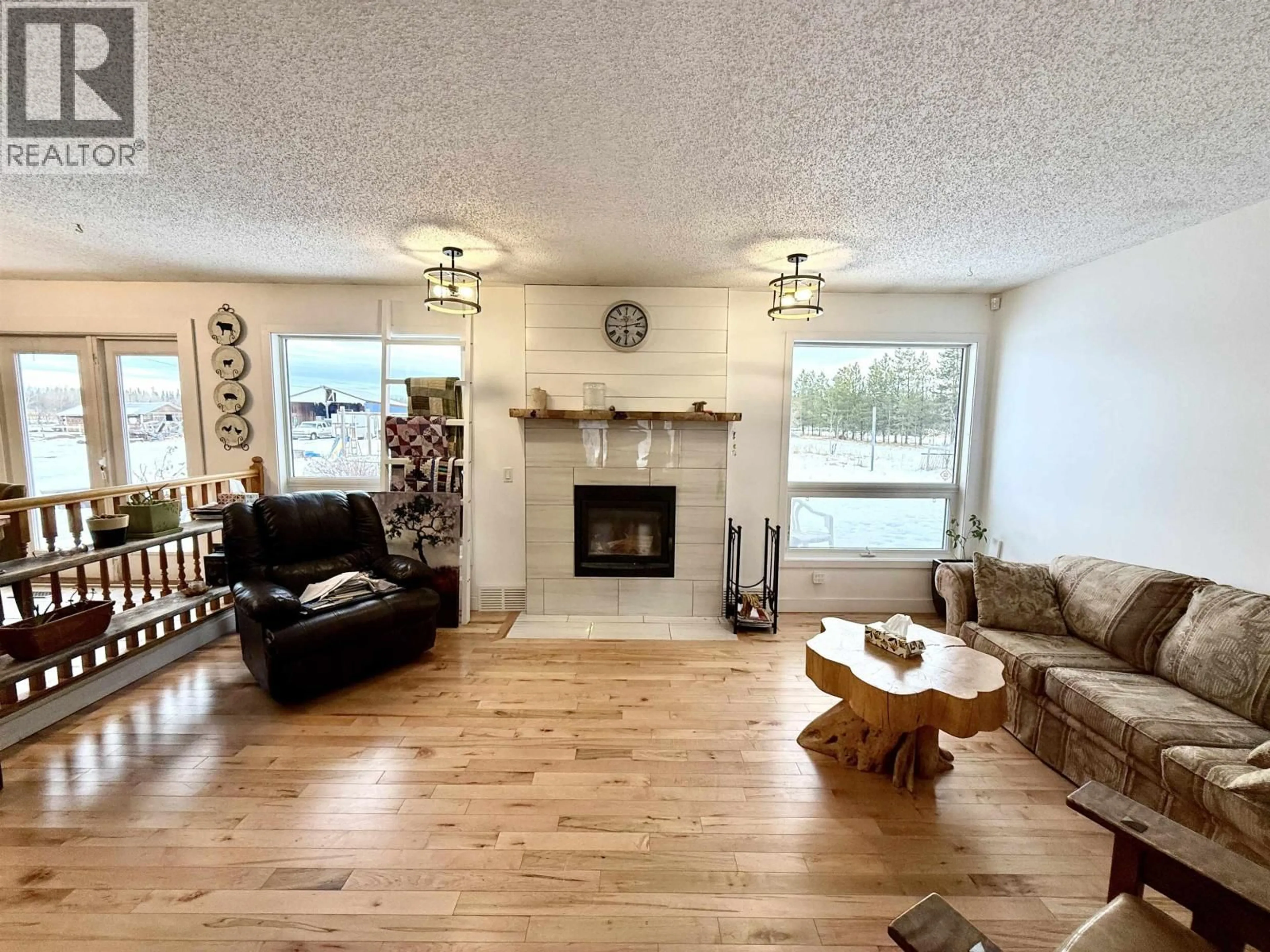 Living room with furniture, wood/laminate floor for 13230 WEST BEAVERLEY ROAD, Prince George British Columbia V2N5A6