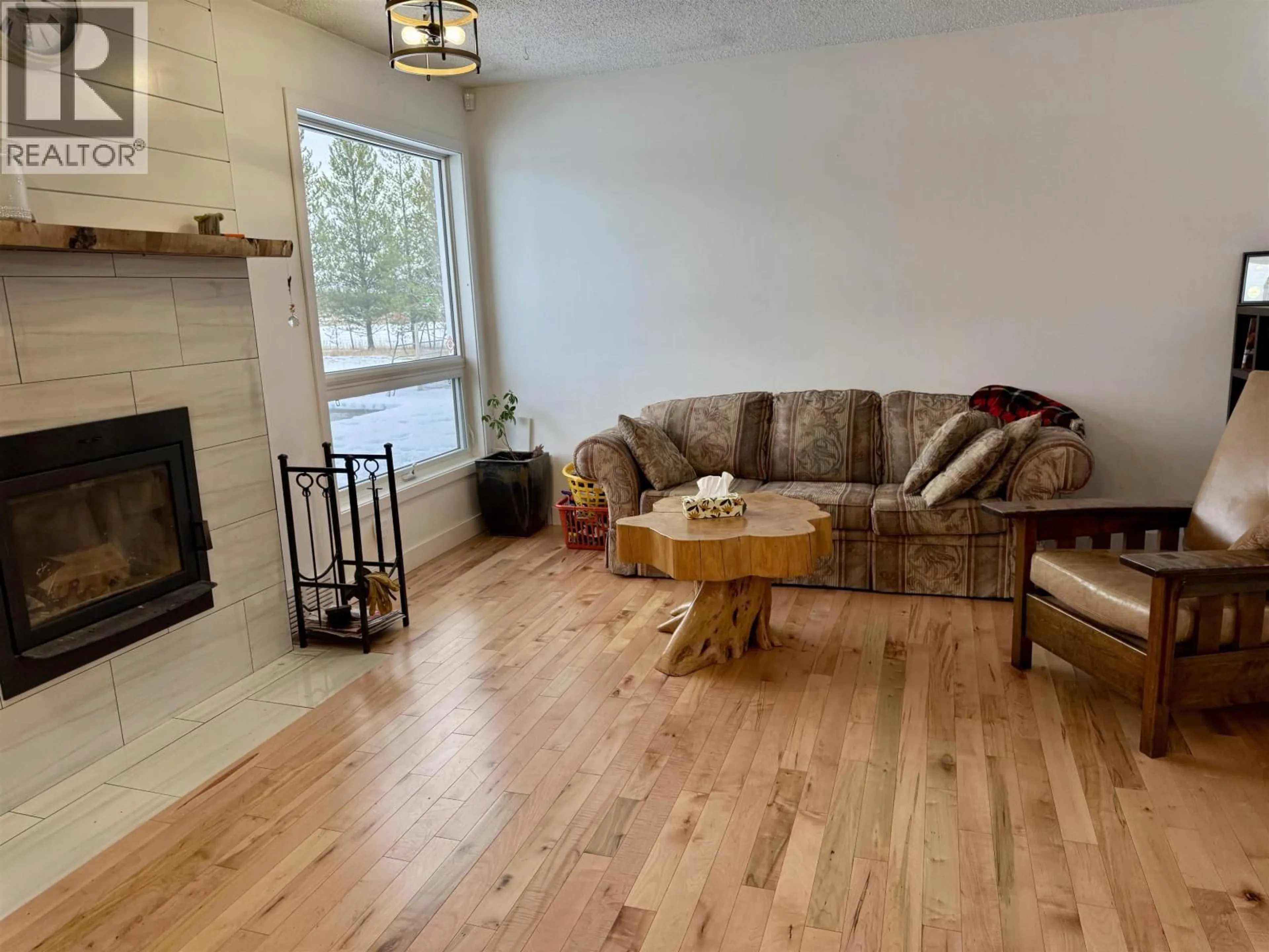 Living room with furniture, wood/laminate floor for 13230 WEST BEAVERLEY ROAD, Prince George British Columbia V2N5A6