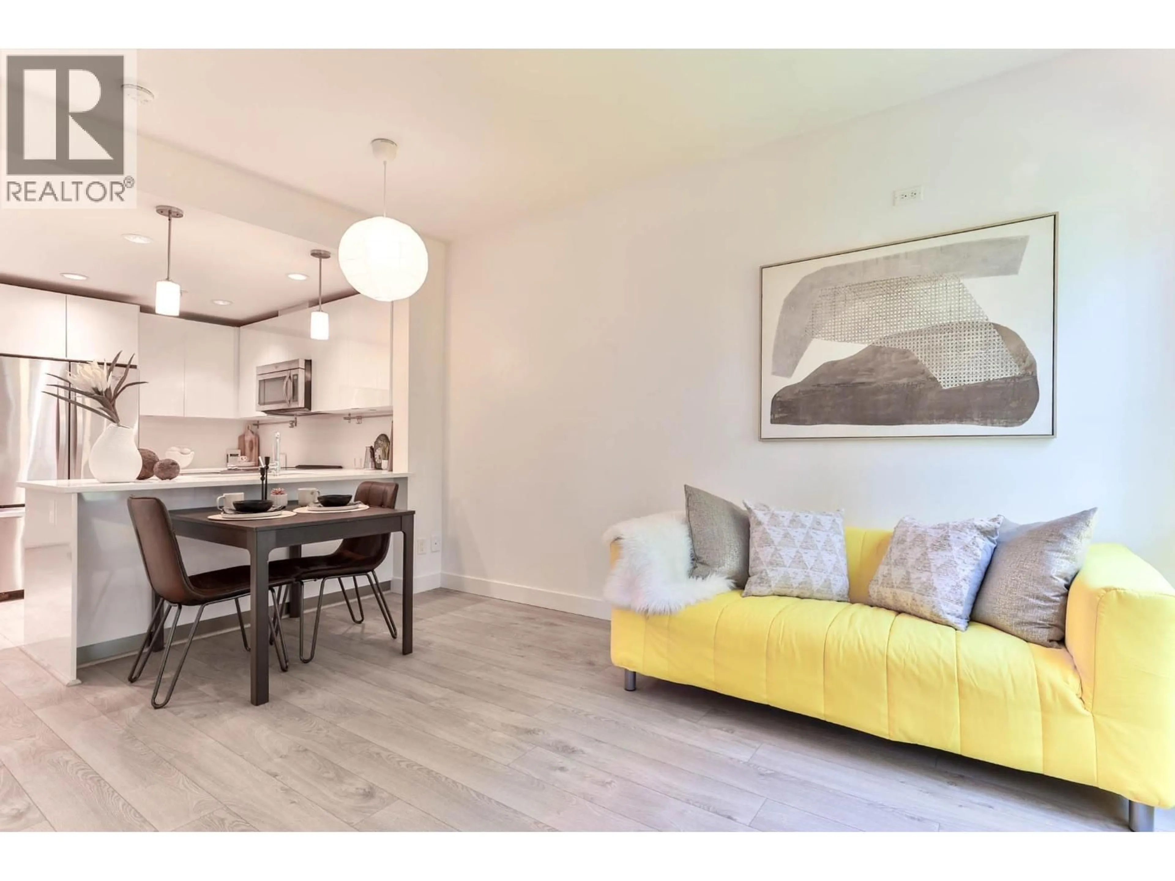 Living room with furniture, wood/laminate floor for 527 - 723 3RD STREET, North Vancouver British Columbia V7M0E4