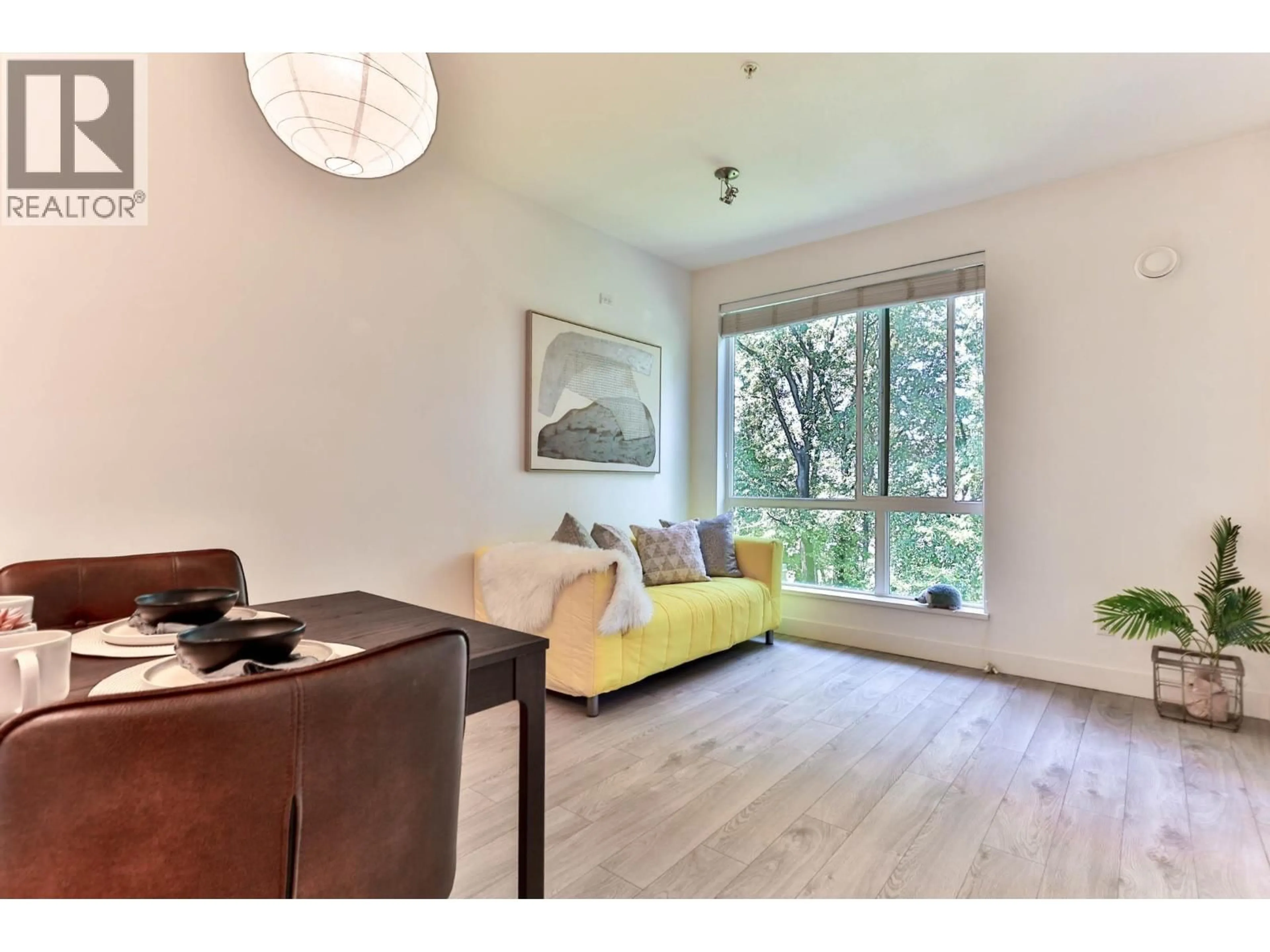 Living room with furniture, wood/laminate floor for 527 - 723 3RD STREET, North Vancouver British Columbia V7M0E4