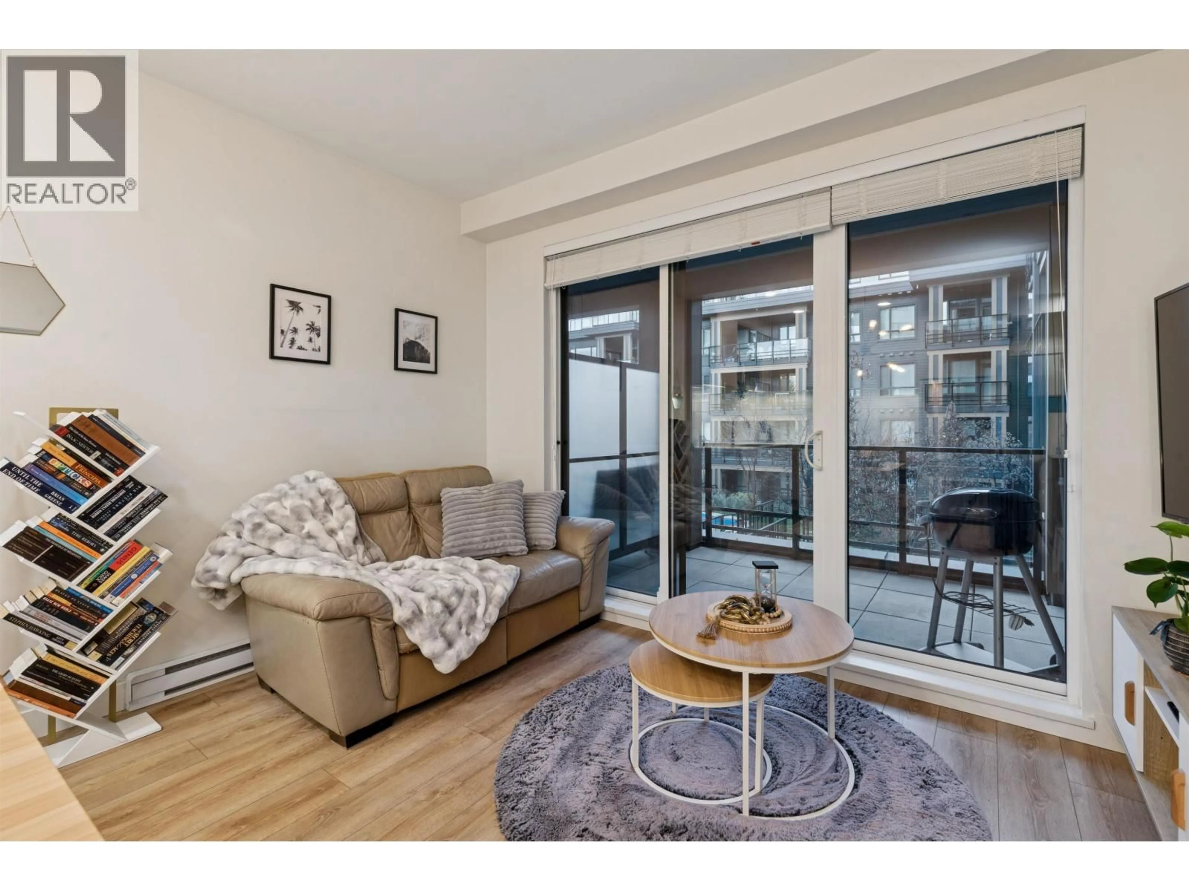 Living room with furniture, wood/laminate floor for 225 - 721 ANSKAR COURT, Coquitlam British Columbia V3J0L4