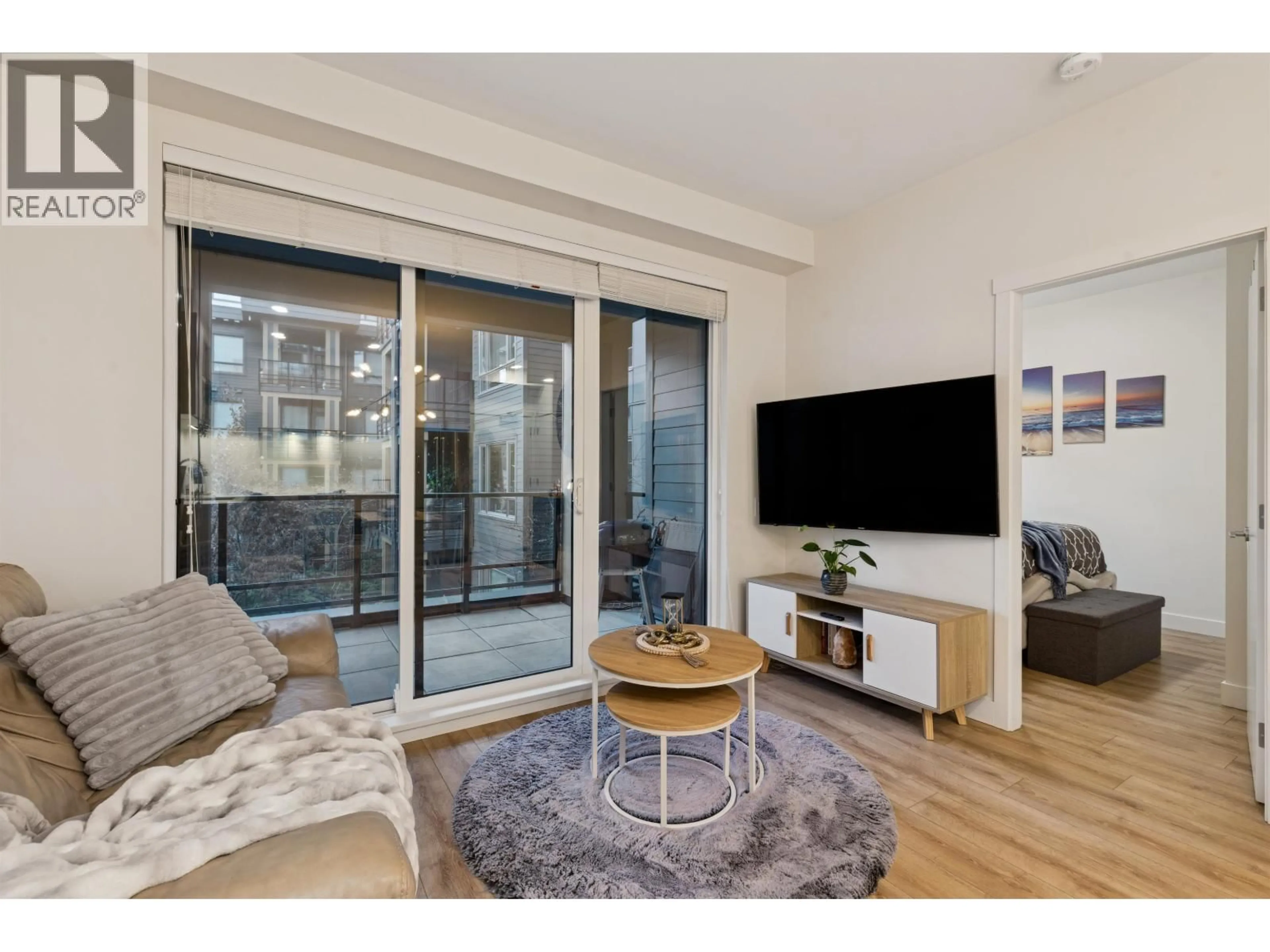 Living room with furniture, wood/laminate floor for 225 - 721 ANSKAR COURT, Coquitlam British Columbia V3J0L4