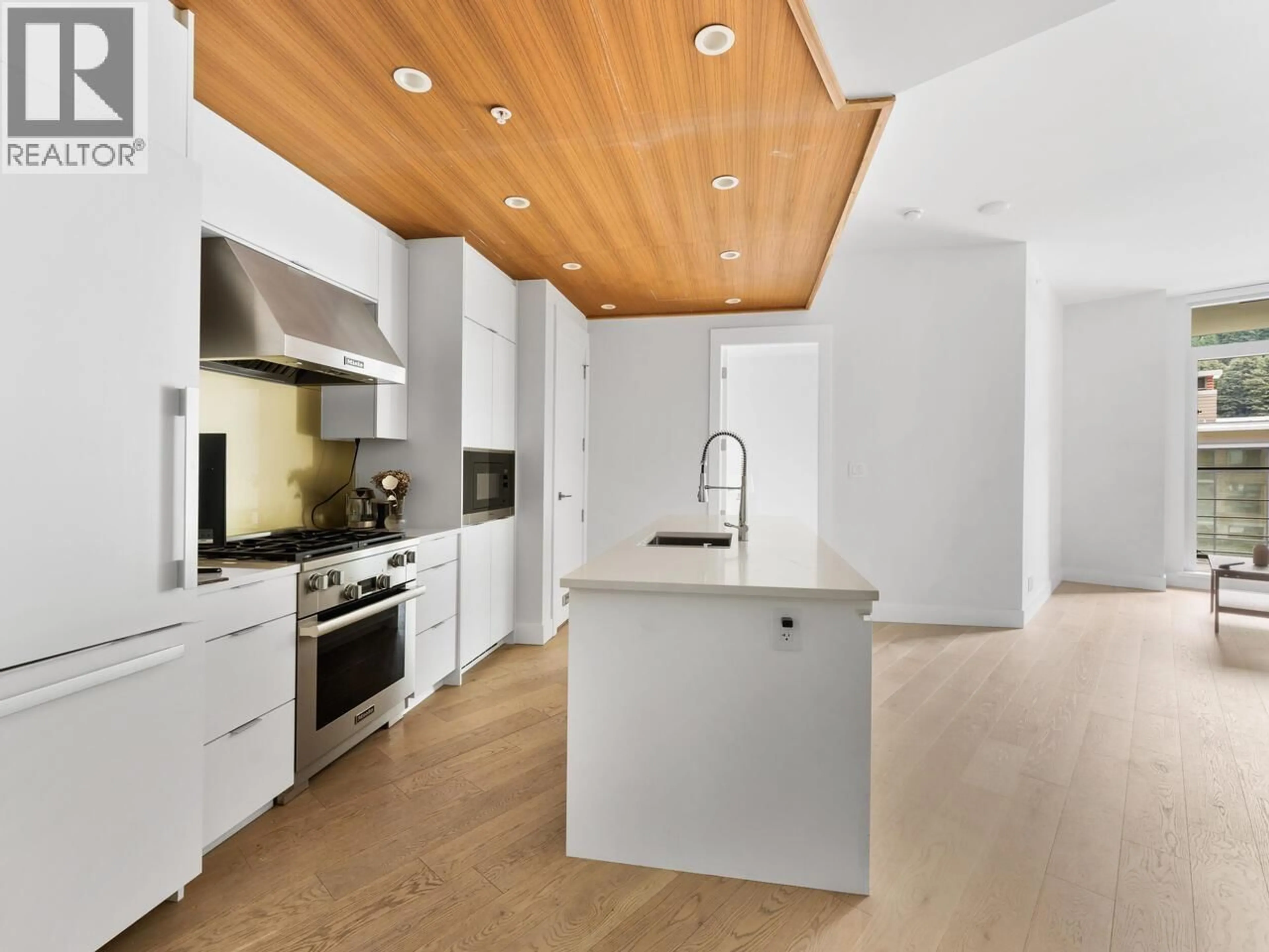 Contemporary kitchen, wood/laminate floor for 405 - 6687 NELSON AVENUE, West Vancouver British Columbia V7W2B2