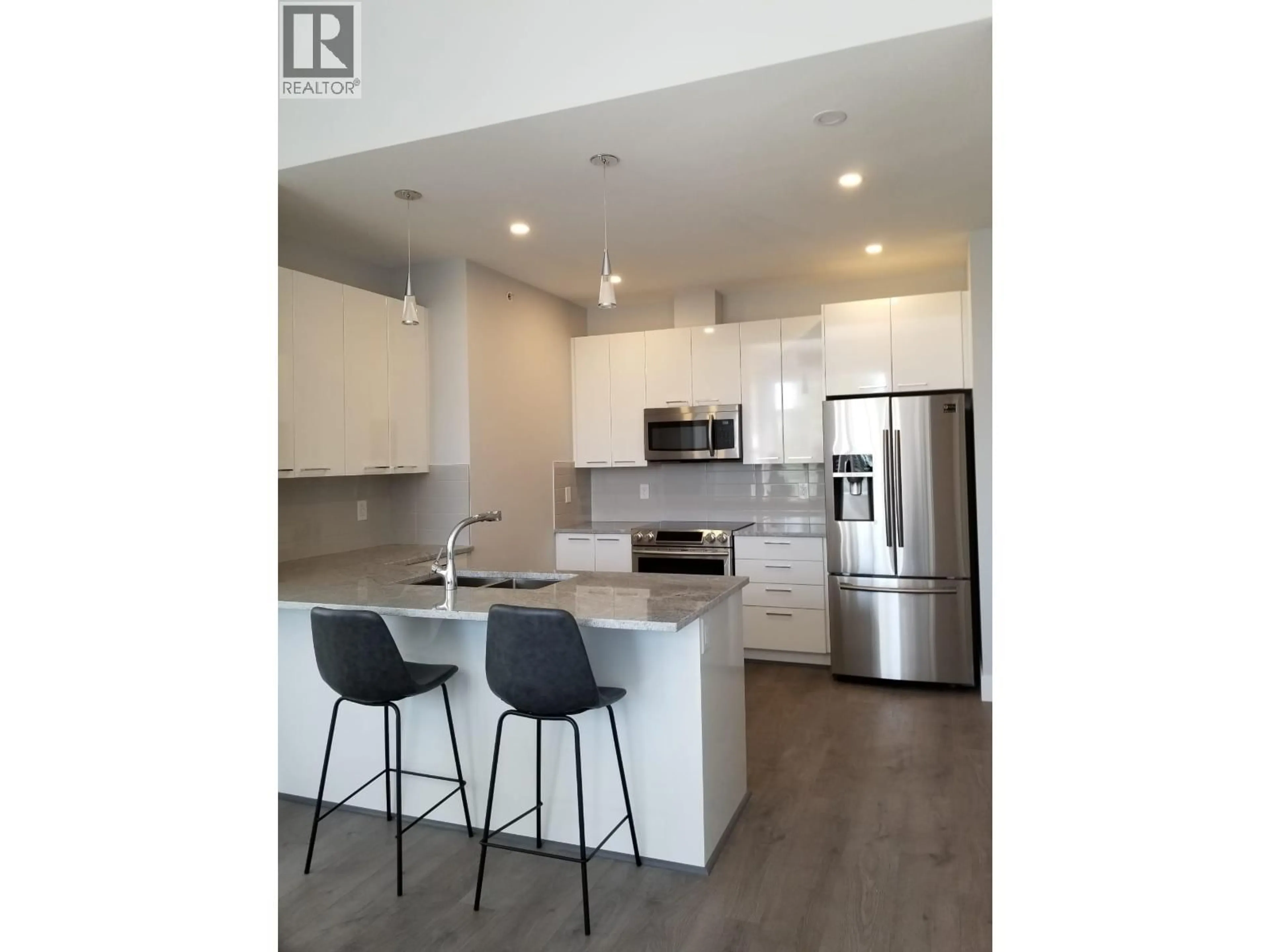 Open concept kitchen, wood/laminate floor for 407 - 22315 122 AVENUE, Maple Ridge British Columbia V2X4K7