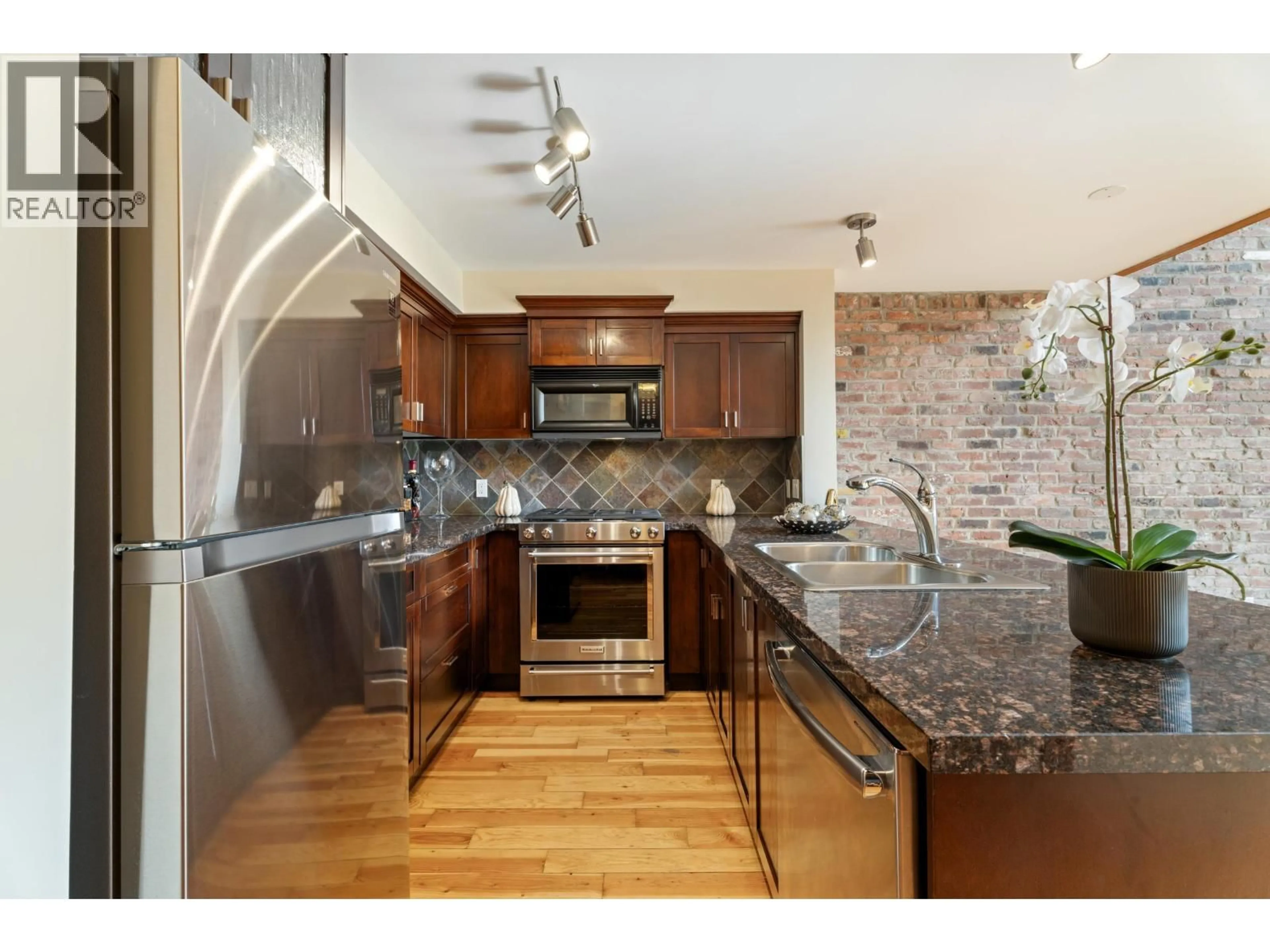 Open concept kitchen, ceramic/tile floor for 201 - 10 RENAISSANCE SQUARE, New Westminster British Columbia V3M7B1