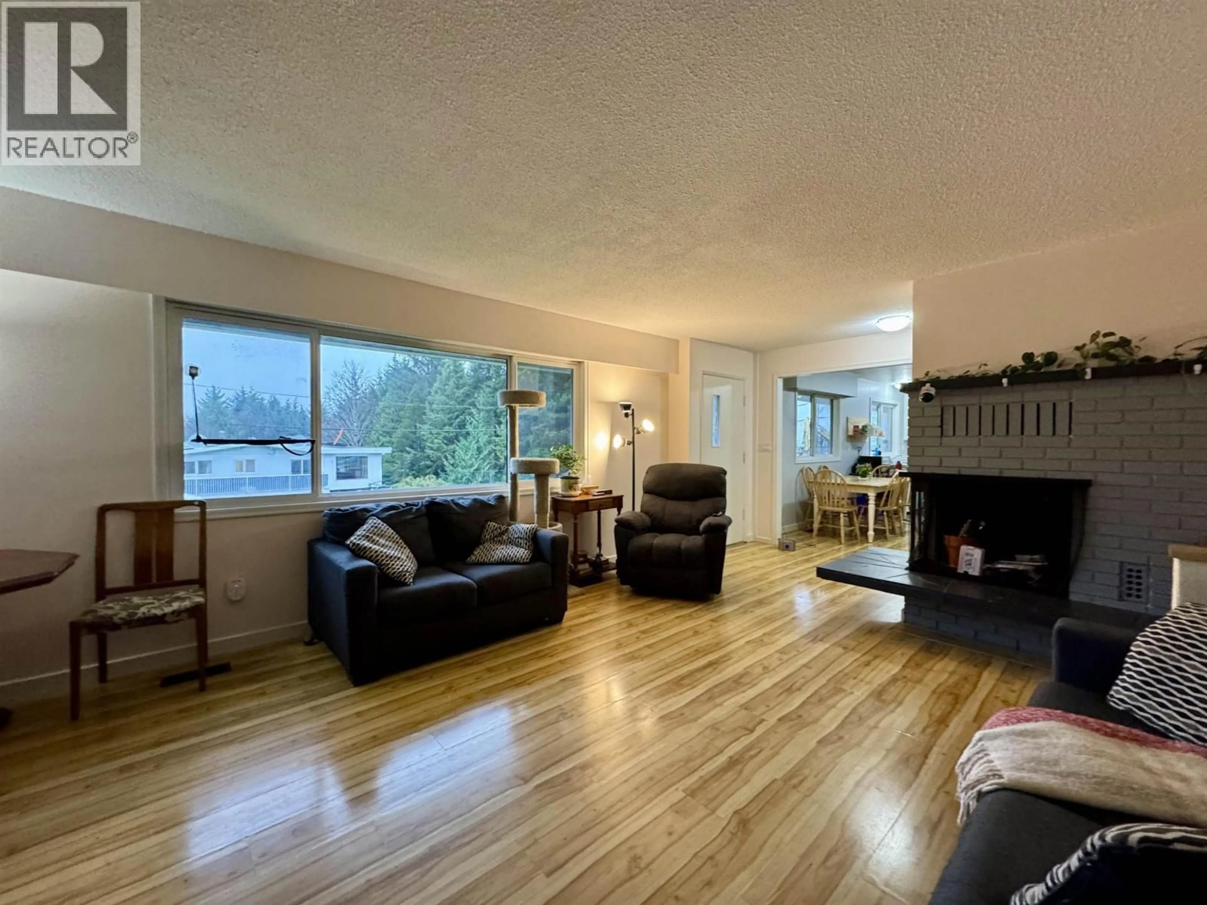 Living room with furniture, wood/laminate floor for 101 CRESTVIEW DRIVE, Prince Rupert British Columbia V8J2Z4