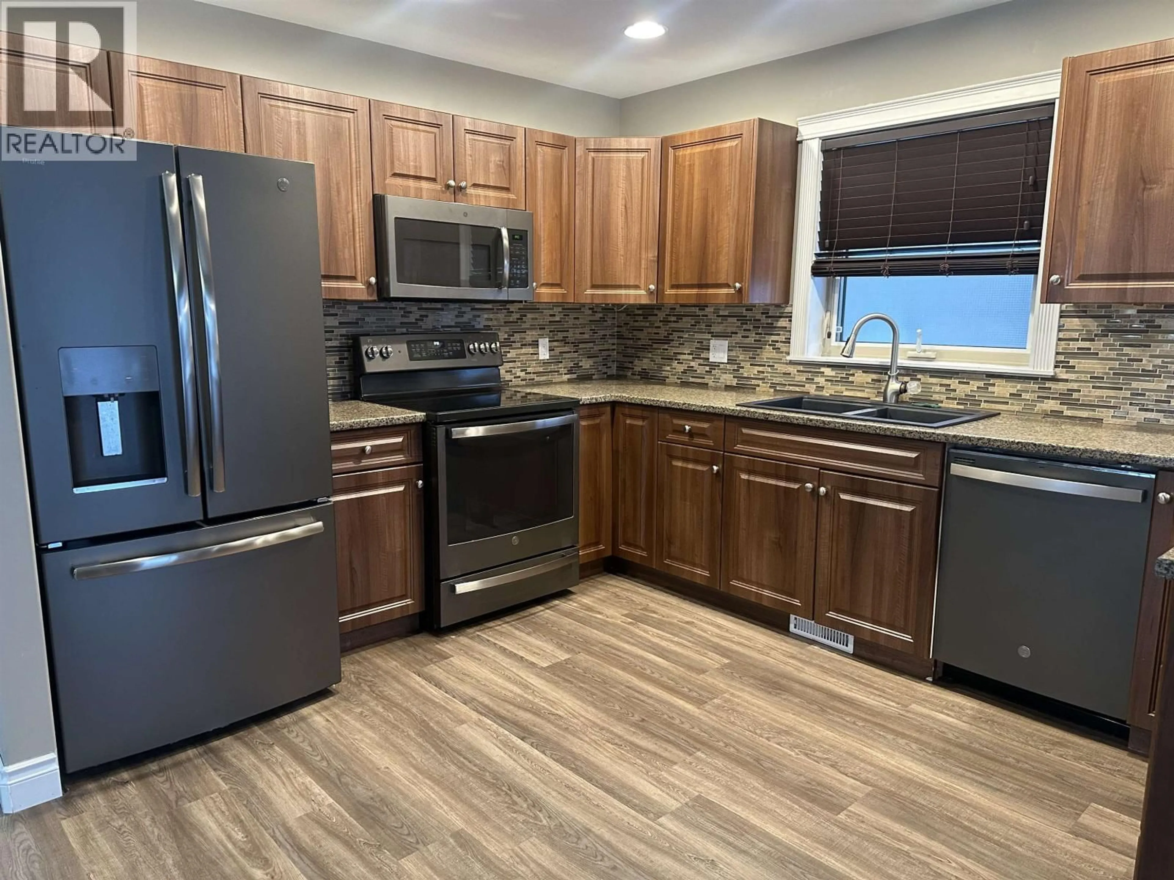 Open concept kitchen, unknown for 8623 114 AVENUE, Fort St. John British Columbia V1J0C3