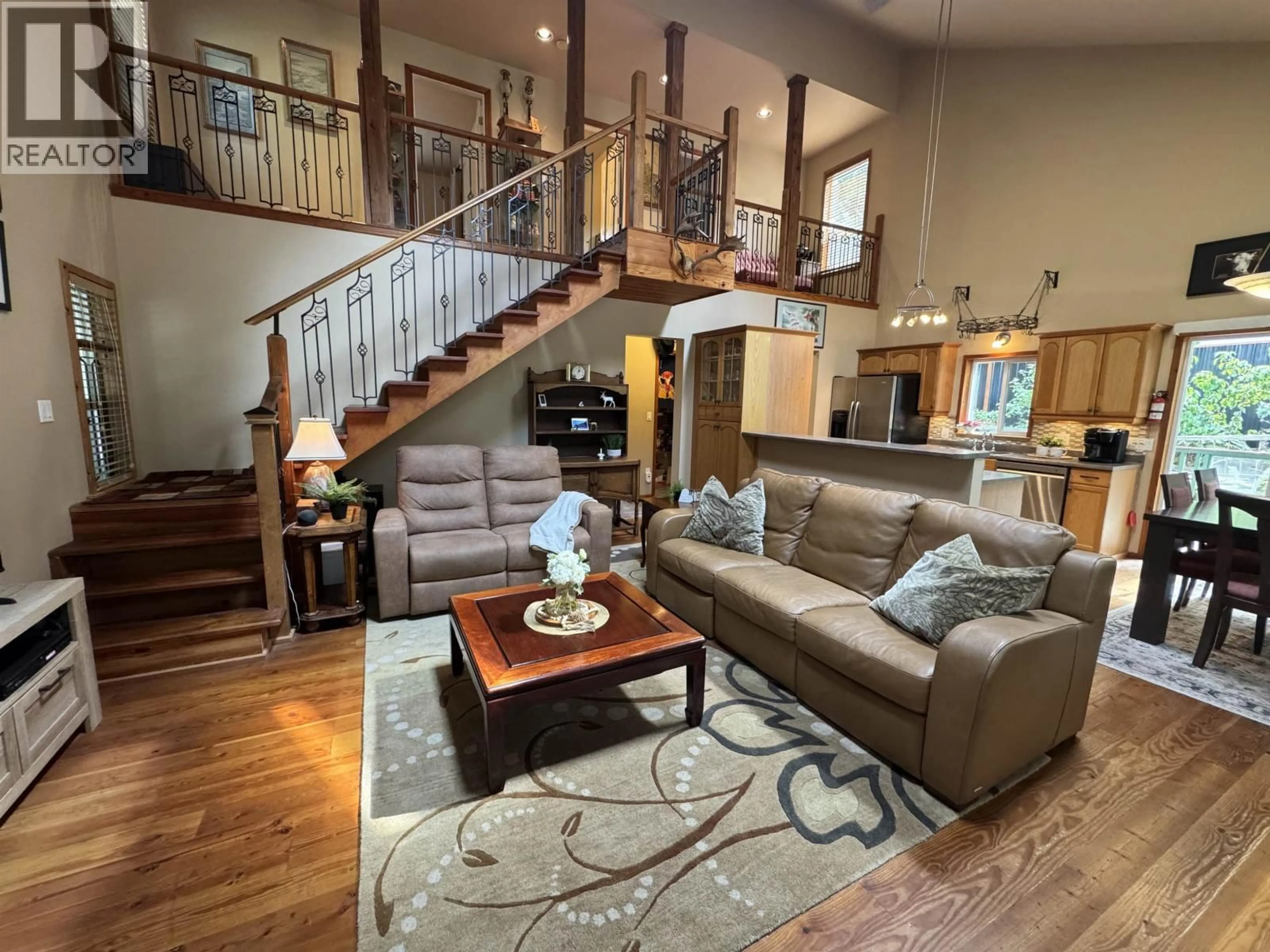 Living room with furniture, wood/laminate floor for 714 CHARTER ROAD, Mayne Island British Columbia V0N2J1