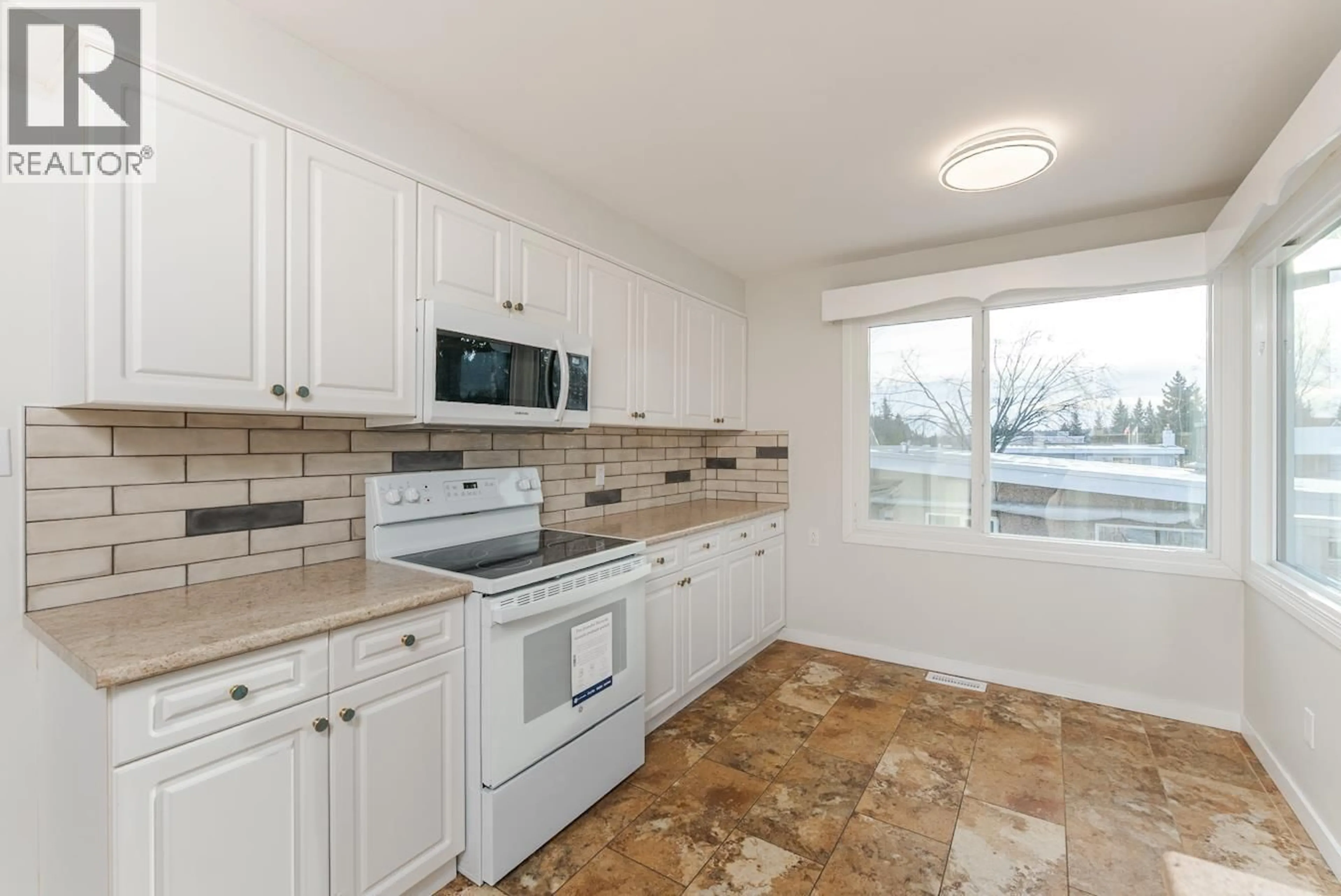 Standard kitchen, ceramic/tile floor for 2425 EWERT CRESCENT, Prince George British Columbia V2M2S1
