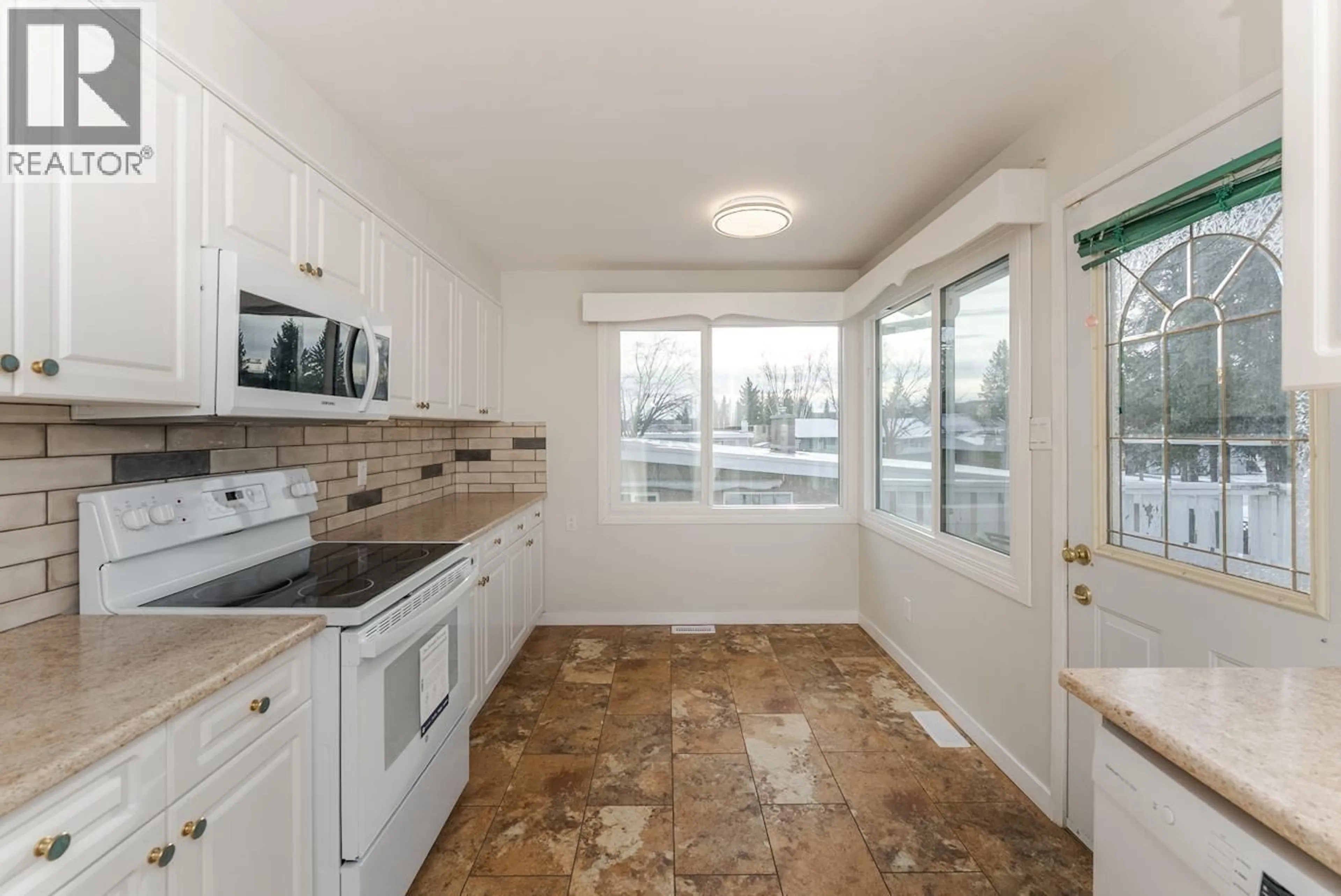Standard kitchen, ceramic/tile floor for 2425 EWERT CRESCENT, Prince George British Columbia V2M2S1