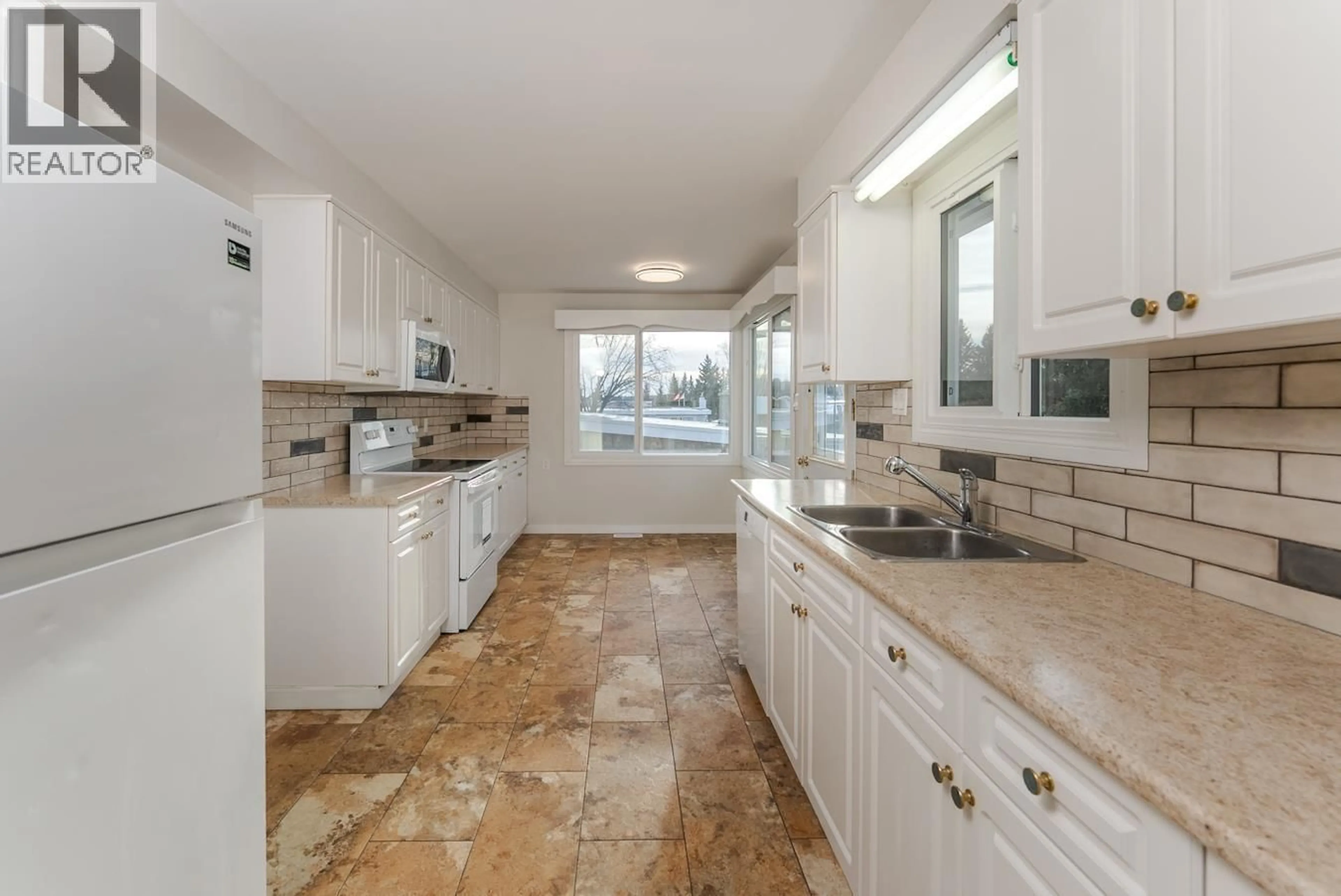 Open concept kitchen, ceramic/tile floor for 2425 EWERT CRESCENT, Prince George British Columbia V2M2S1