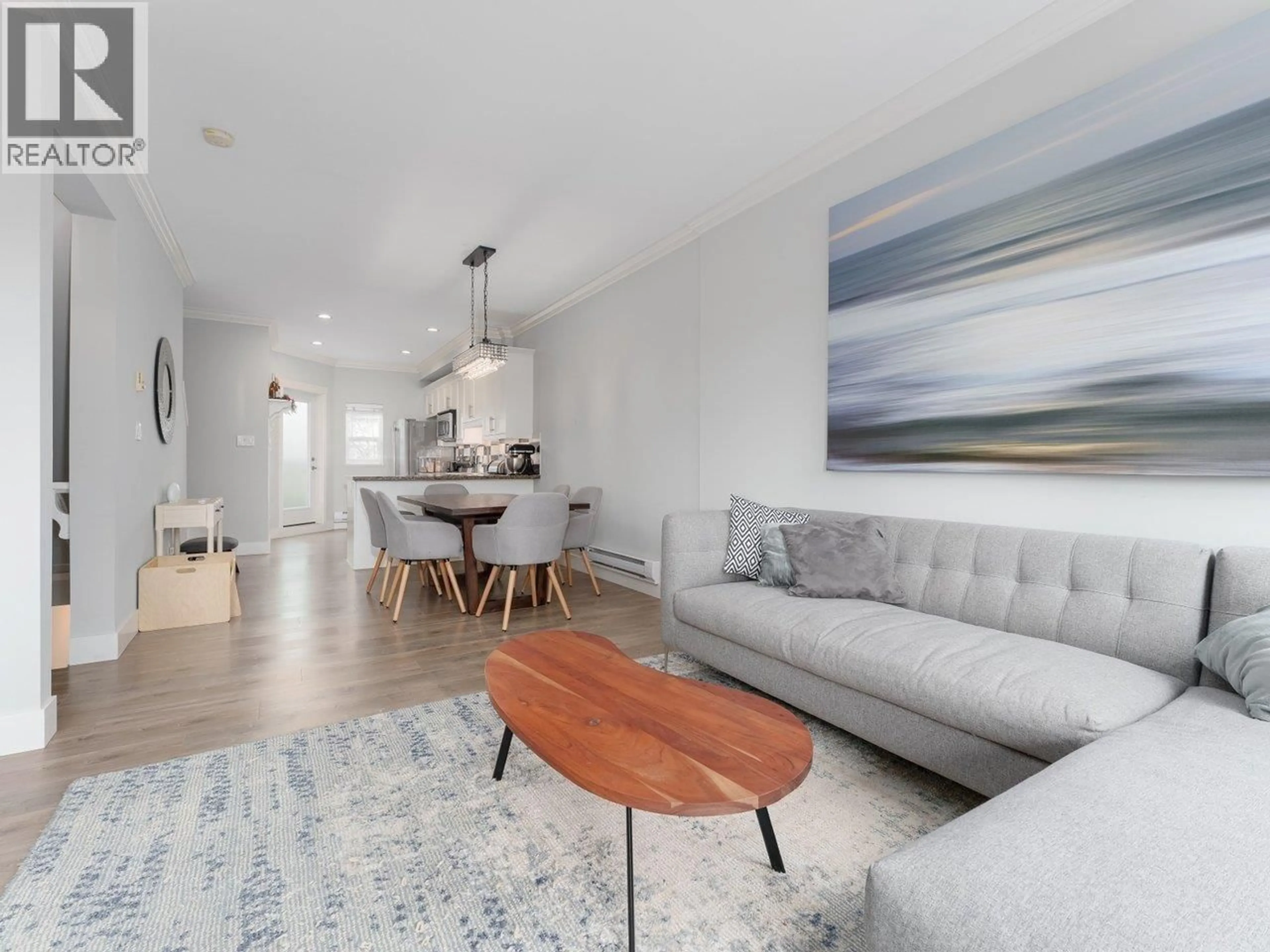 Living room with furniture, wood/laminate floor for 29 - 22788 WESTMINSTER HIGHWAY, Richmond British Columbia V6V0B1
