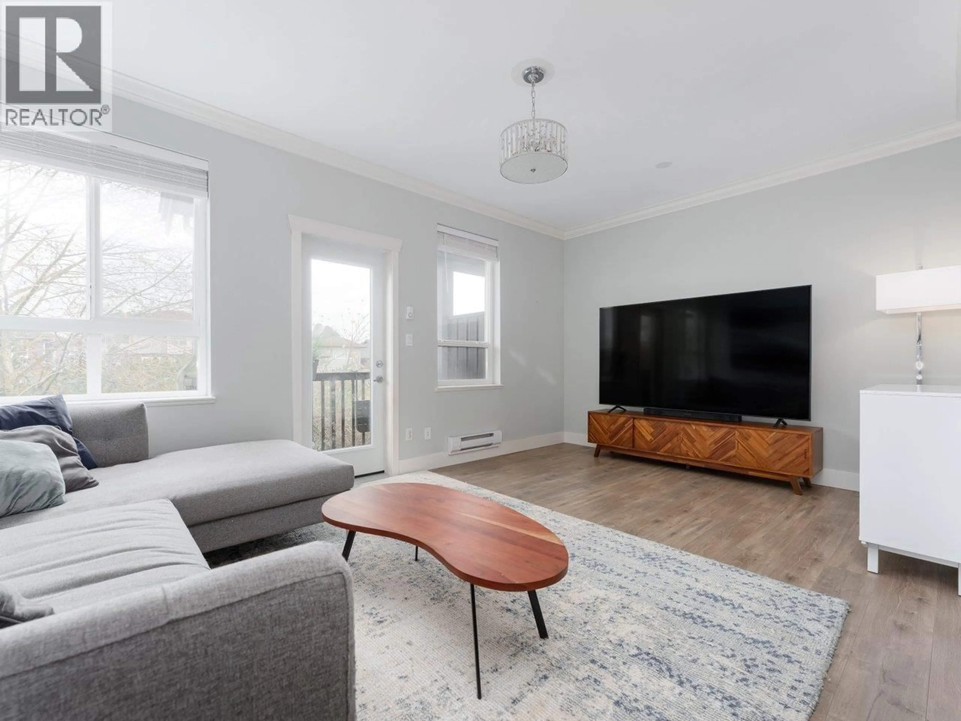 Living room with furniture, wood/laminate floor for 29 - 22788 WESTMINSTER HIGHWAY, Richmond British Columbia V6V0B1