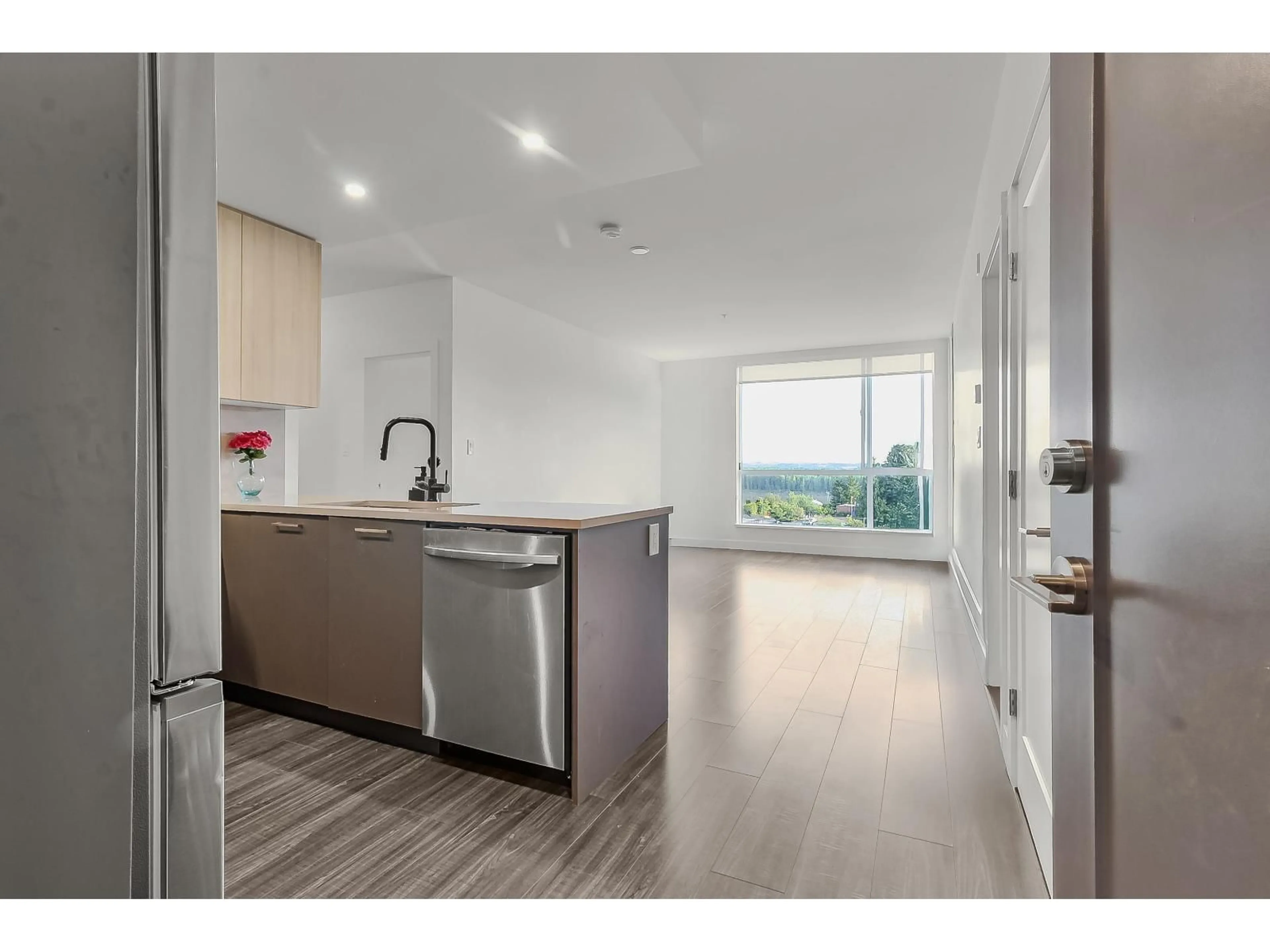 Open concept kitchen, wood/laminate floor for 206 - 31900 RAVEN AVENUE, Mission British Columbia V2V0H5